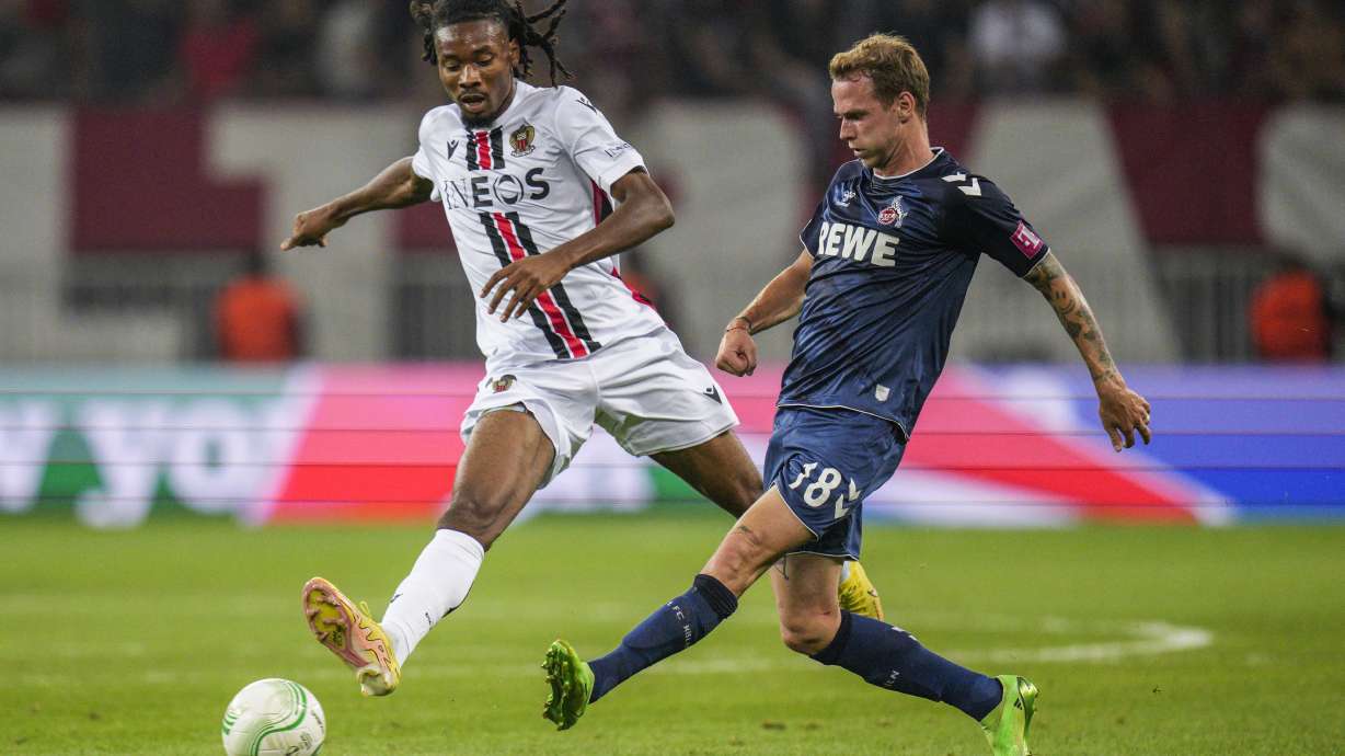 FILE - Nice's Khephren Thuram, left, challenges for the ball with Cologne's Ondrej Duda during the Europa Conference League Group D match between OCG Nice and FC Koln, in Nice, France, on Sept. 8, 2022. Khephren Thuram signed with his father’s former club Juventus on Wednesday, joining brother Marcus in Serie A.