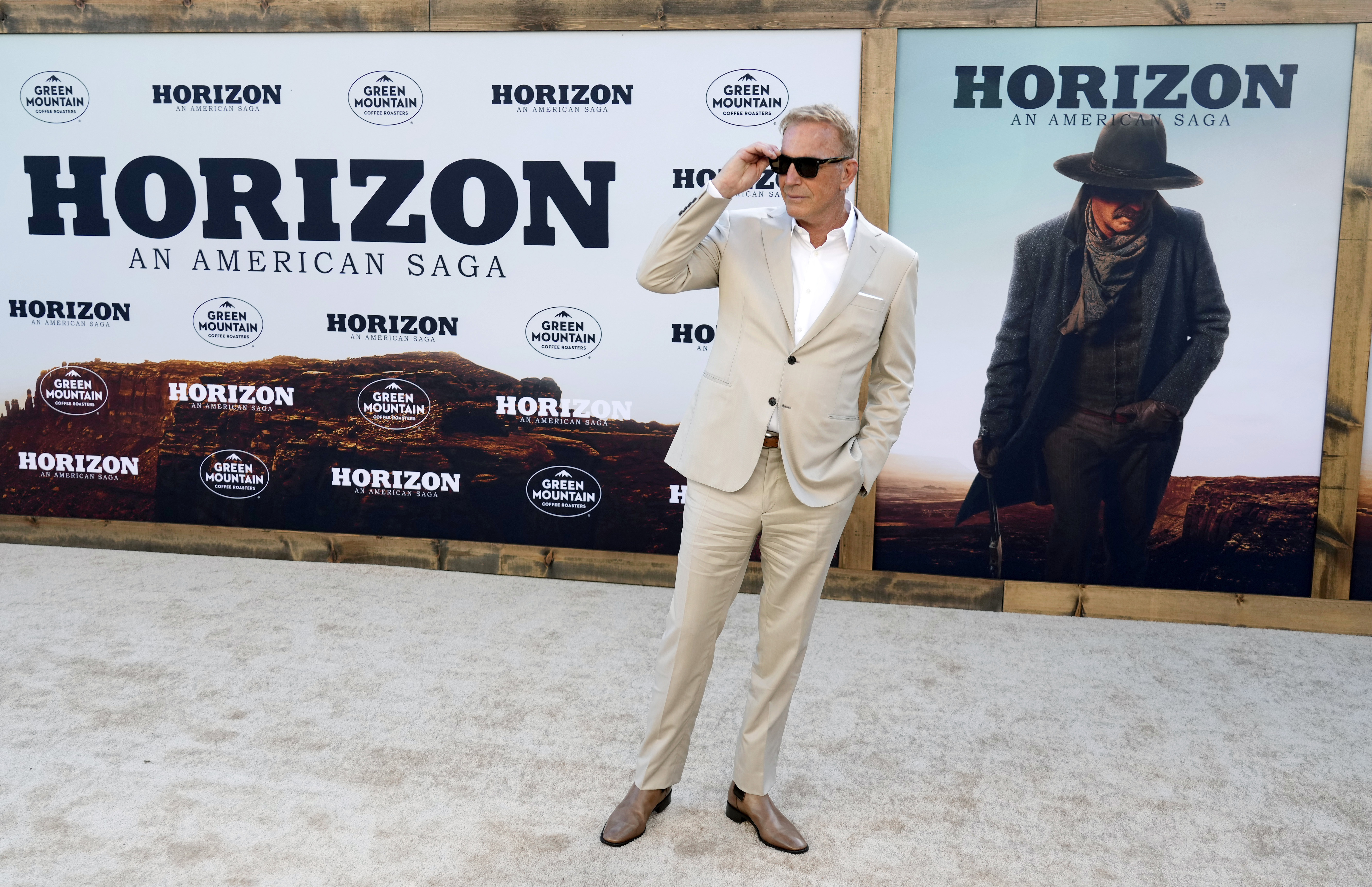 Kevin Costner, the director, co-writer and star of "Horizon: An American Saga," poses at the premiere of the film at the Regency Village Theatre, Monday, in Los Angeles.