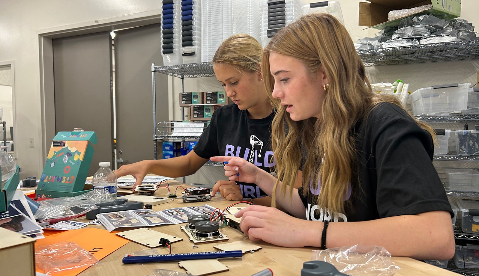 Two students stop to think while building their Bluetooth speakers, St. George, June 27.