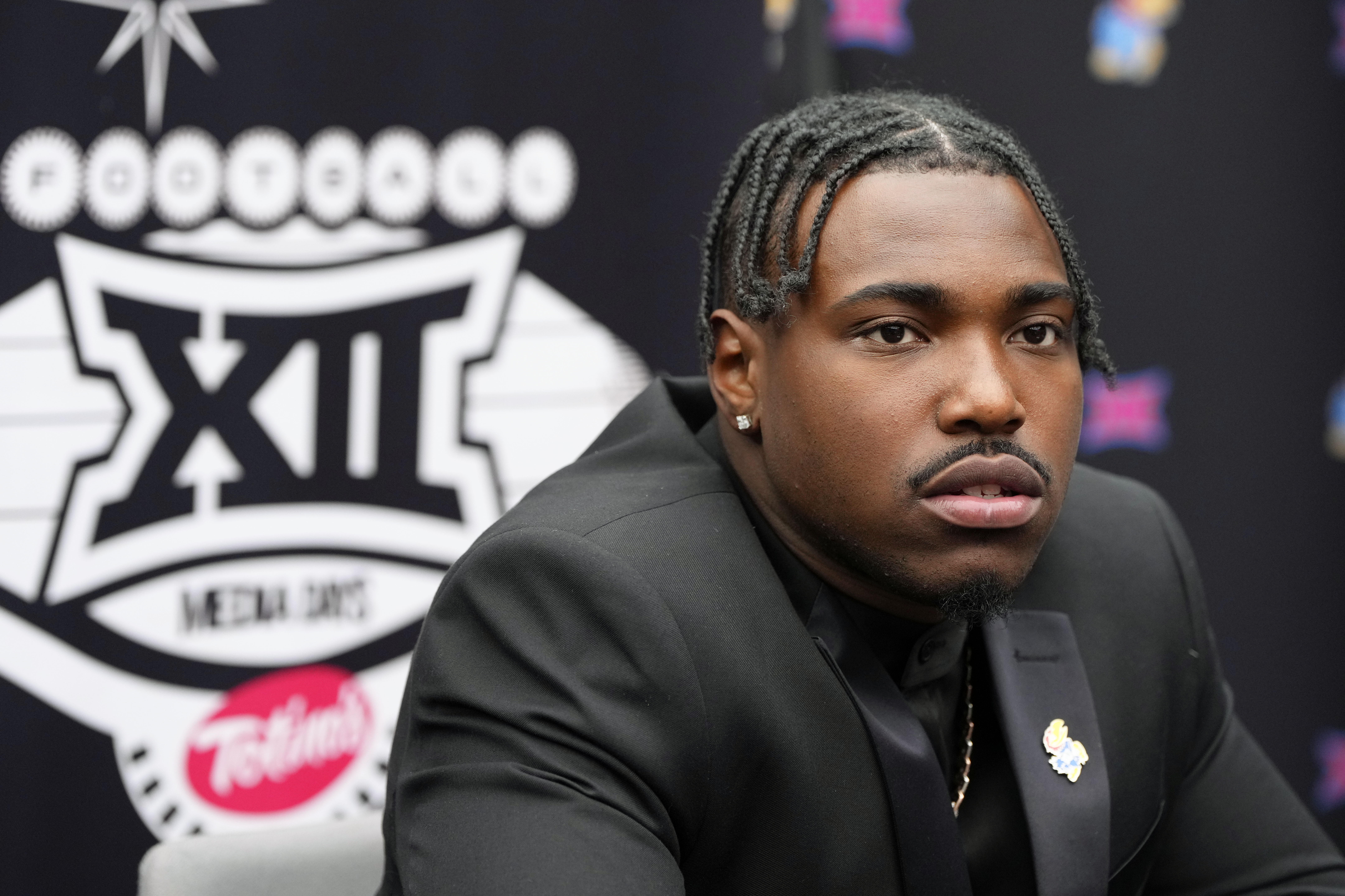 Kansas quarterback Jalon Daniels answers questions from the media during Big 12 NCAA college football media days in Las Vegas, Wednesday, July 10, 2024. 