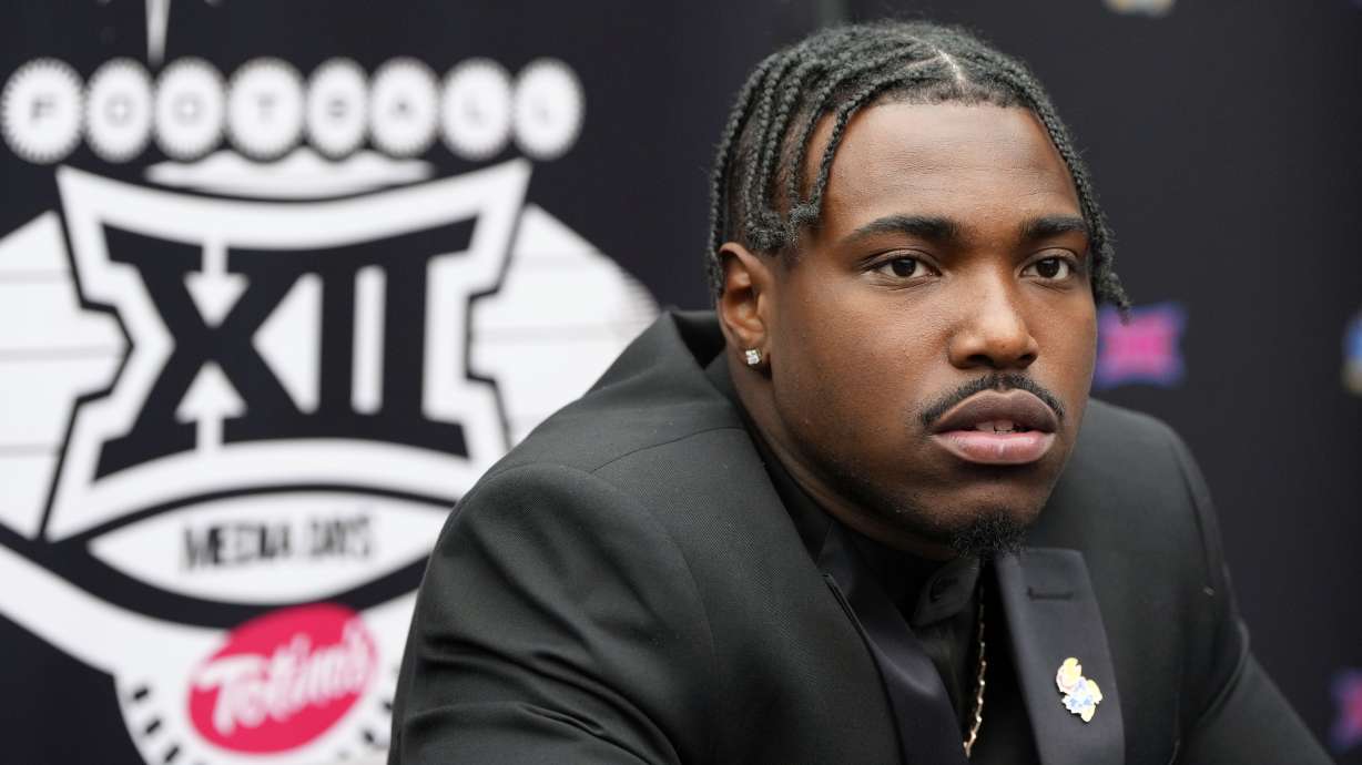 Kansas quarterback Jalon Daniels answers questions from the media during Big 12 NCAA college football media days in Las Vegas, Wednesday, July 10, 2024.