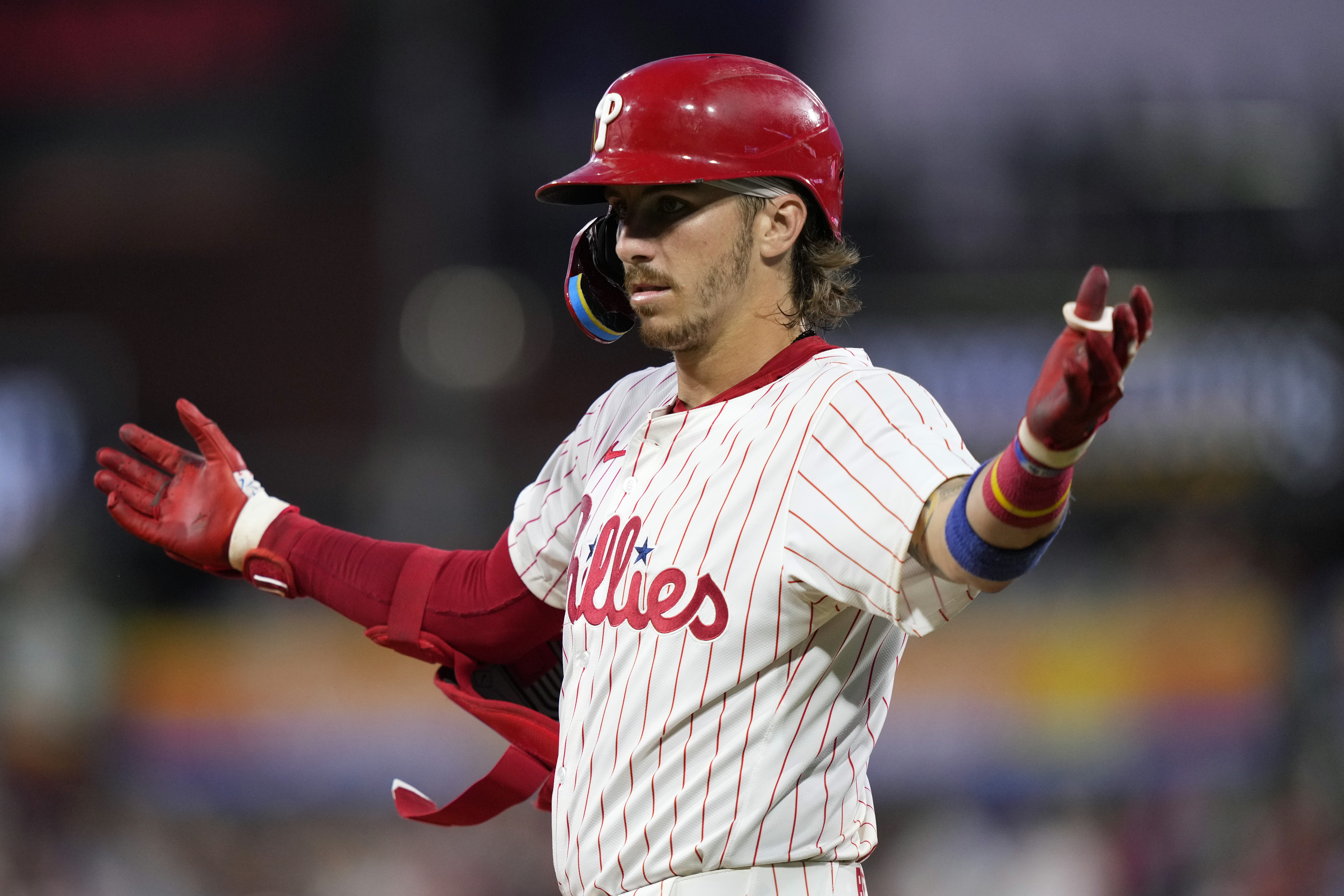 Philadelphia Phillies' Bryson Stott reacts after hitting a run-scoring single against Los Angeles Dodgers pitcher Anthony Banda during the fifth inning of a baseball game, Wednesday, July 10, 2024, in Philadelphia. 