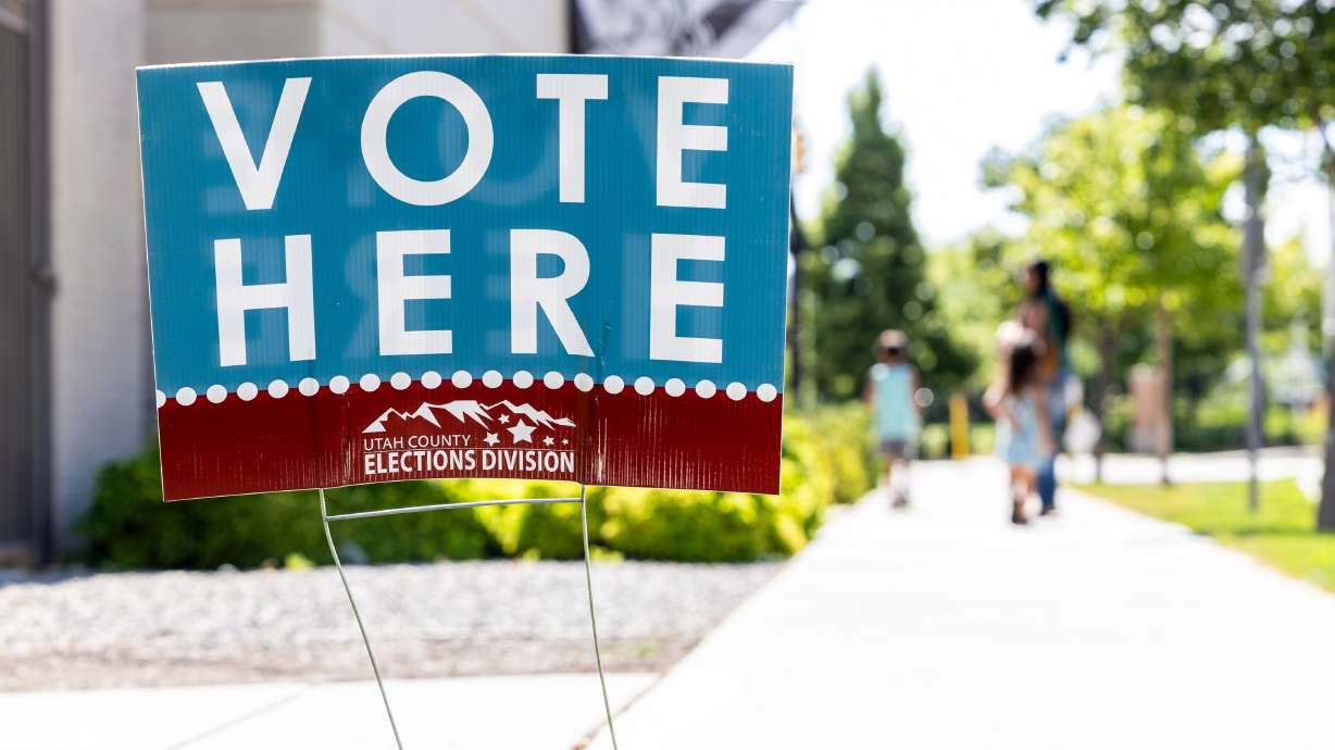 A “Vote Here” sign is displayed during primary election voting held at the Utah County Health and Justice Building in Provo on June 25. The SAVE Act will require voters to show proof of citizenship to cast their ballot in federal races.
