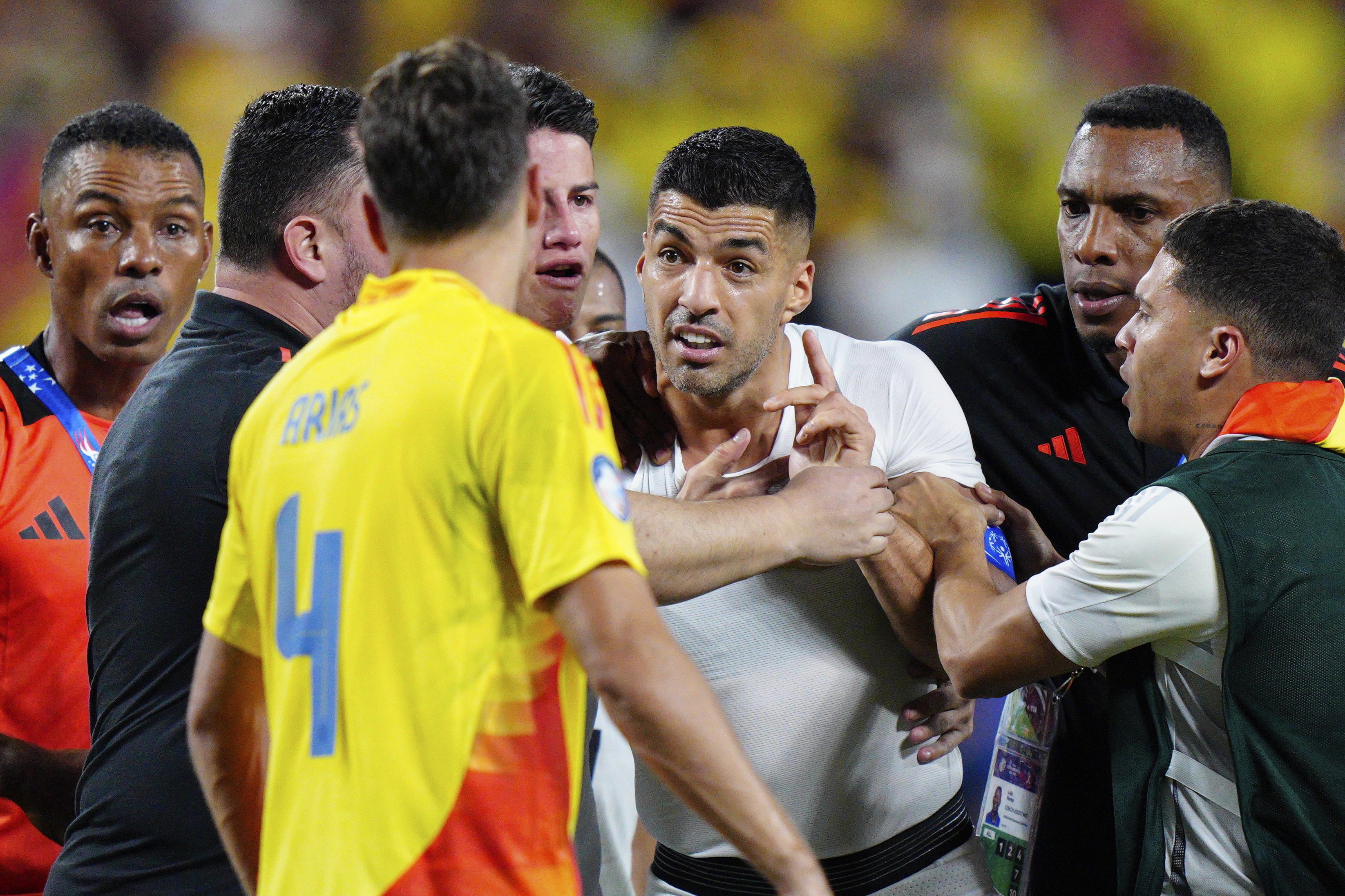Uruguay's Luis Suarez argues with Colombia's Santiago Arias after their Copa America semifinal soccer match in Charlotte, N.C., Wednesday, July 10, 2024. 