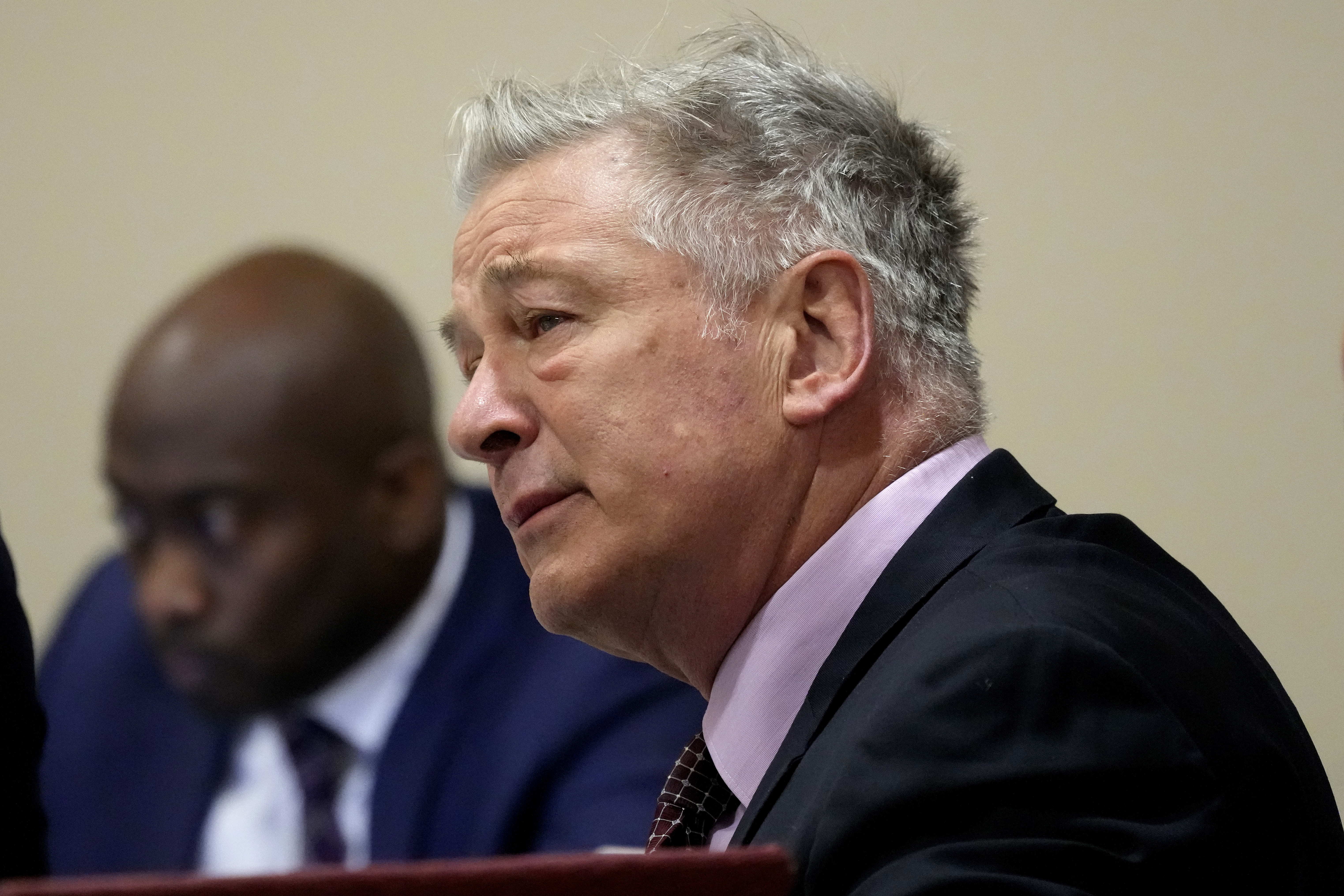 Actor Alec Baldwin listens during his hearing in Santa Fe County District Court, Wednesday in Santa Fe, N.M. Baldwin is facing a single charge of involuntary manslaughter in the death of a cinematographer.