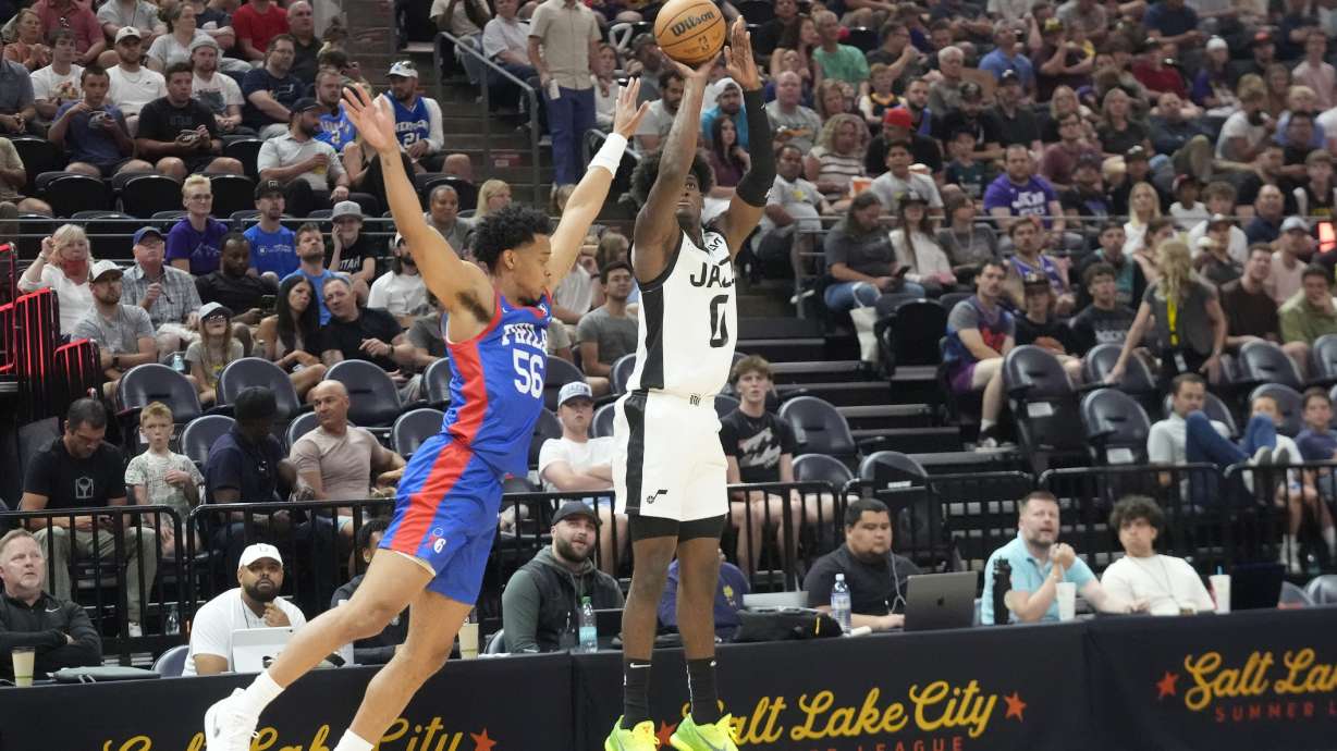 Utah Jazz forward Taylor Hendricks (0) shoots as Philadelphia 76ers Jaylen Sims (56) defends during the first half of an NBA summer league basketball game Wednesday, July 10, 2024, in Salt Lake City.