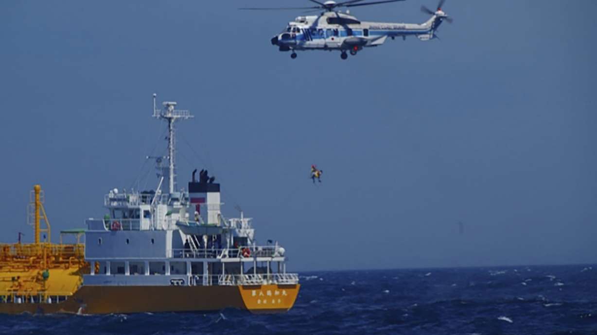 A woman is airlifted by a coast guard helicopter off Nojimazaki, Chiba prefecture, Japan Wednesday. She was swept out to sea while swimming at a Japanese beach and was rescued 37 hours later after drifting in a swimming ring 50 miles away.