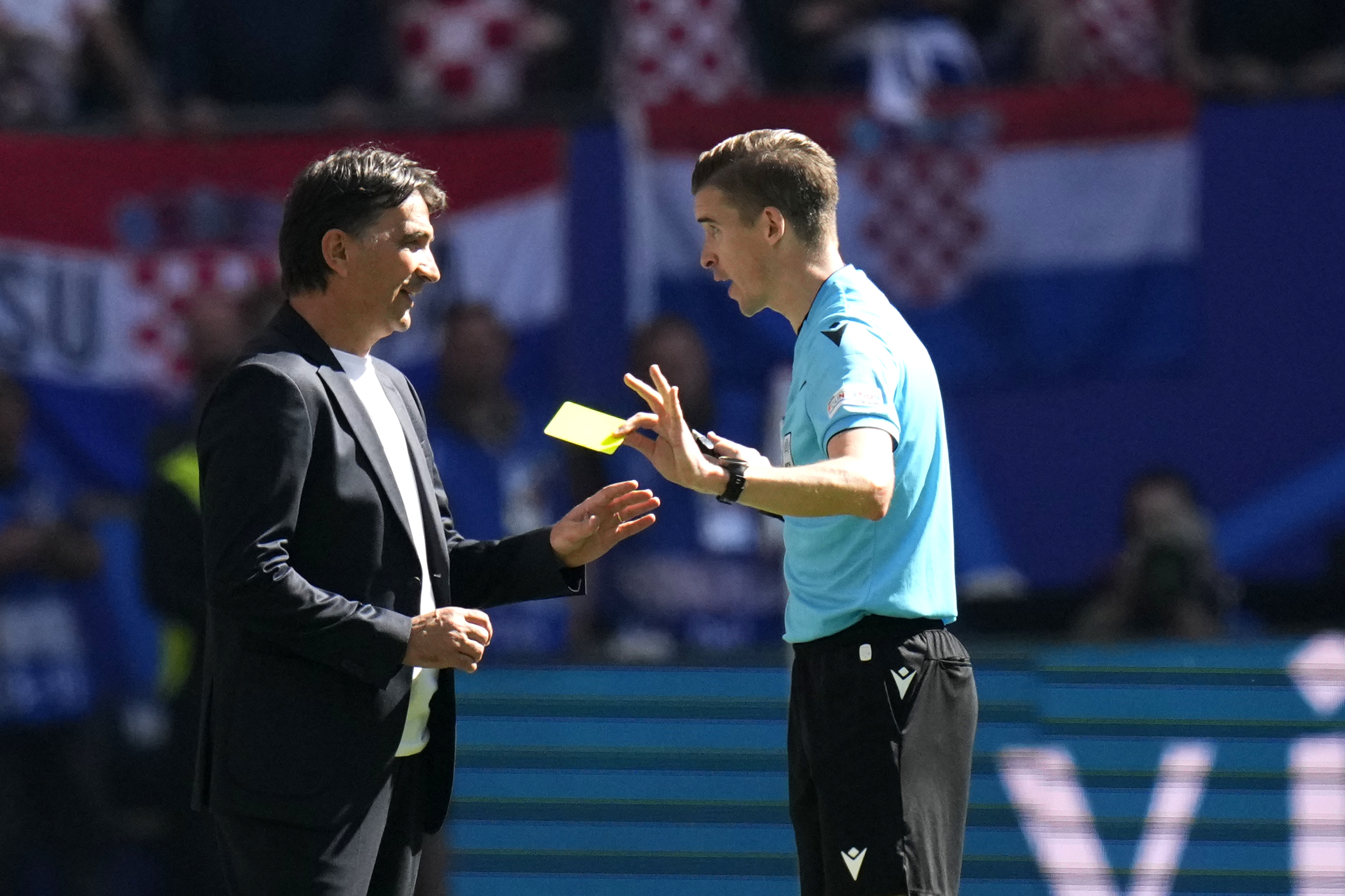 referee François Letexier of France, right, has a word with Croatia's head coach Zlatko Dalic during a Group B match between Croatia and Albania at the Euro 2024 soccer tournament in Hamburg, Germany, Wednesday, June 19, 2024.