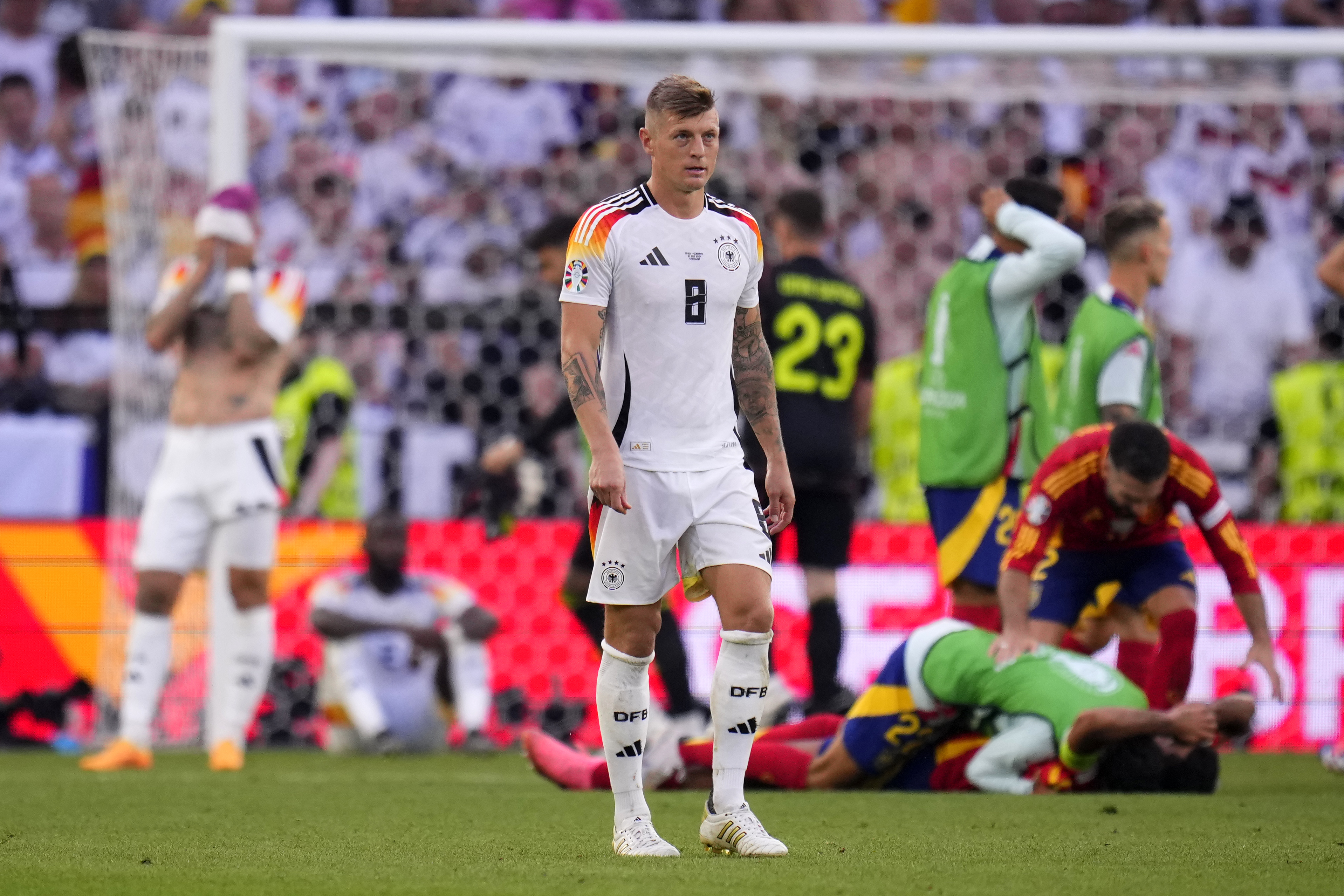 Germany's Toni Kroos walks off the pitch after a quarterfinal match between Germany and Spain at the Euro 2024 soccer tournament in Stuttgart, Germany, Friday, July 5, 2024. 