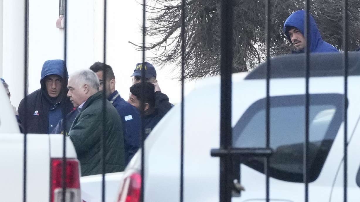 Police escort French rugby players Oscar Jegou, left, and Hugo Auradou, right, in Buenos Aires, Argentina, Thursday, July 11, 2024. The players were arrested following a formal complaint filed against them for alleged sexual assault, after France played Argentina in a test rugby match in Mendoza on July 6.