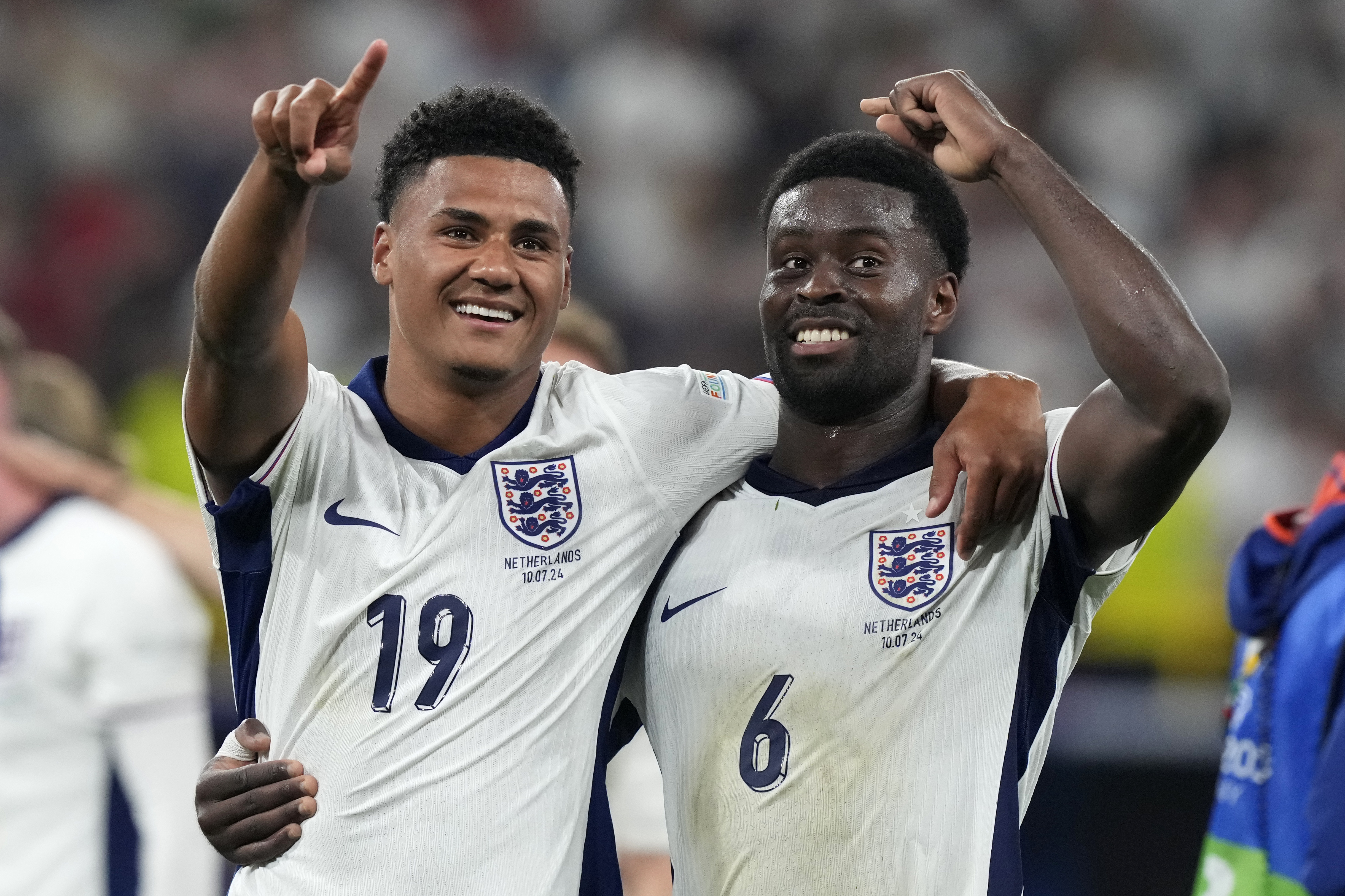England's Ollie Watkins, left, celebrates with England's Marc Guehi after winning a semifinal match between the Netherlands and England at the Euro 2024 soccer tournament in Dortmund, Germany, Wednesday, July 10, 2024. 
