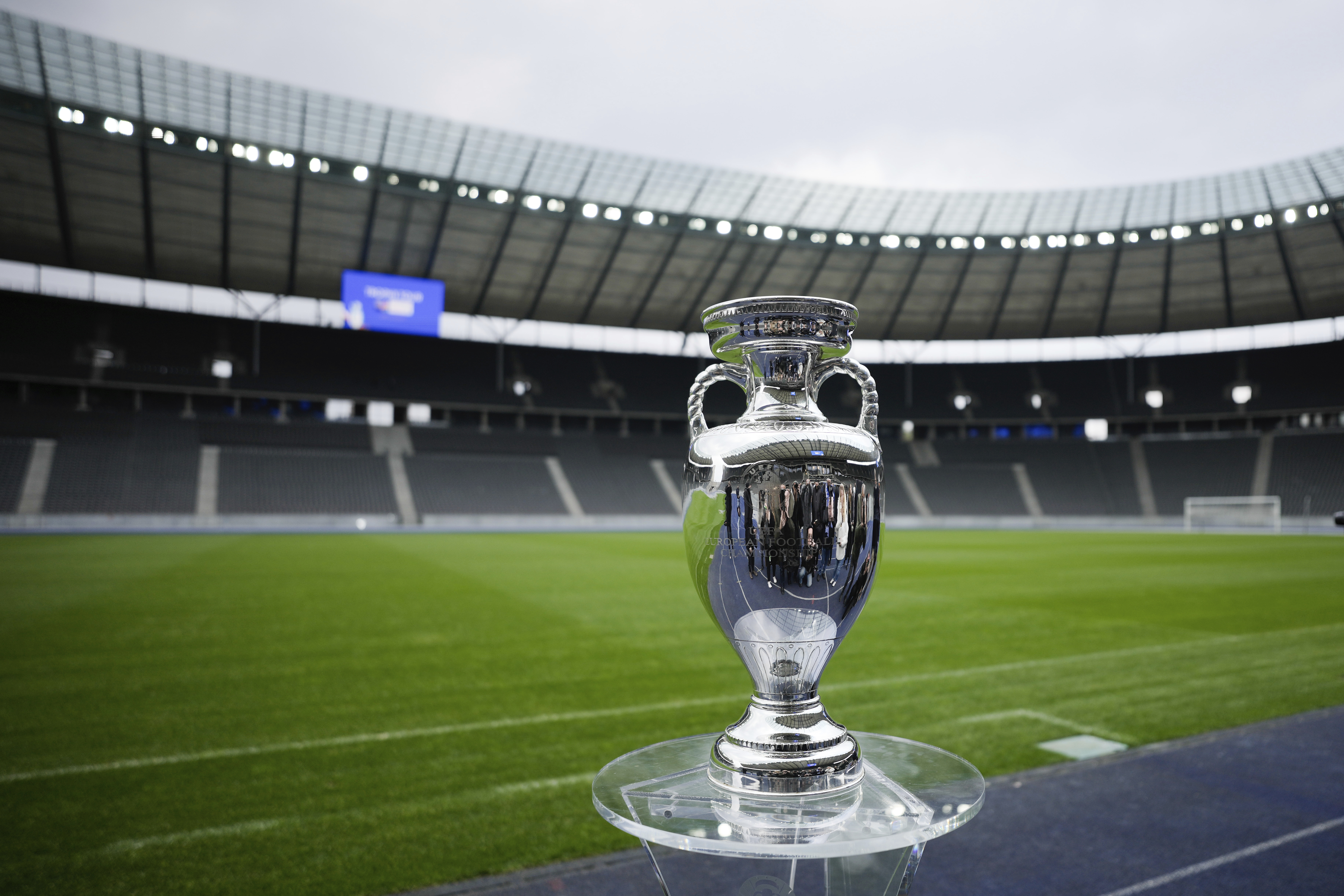 FILE - The trophy is on display during the presentation of the European soccer championship 'EURO 2024' trophy at the Olympic Stadium in Berlin, Germany, Wednesday, April 24, 2024. The Euros kick off in Munich, Friday June 14, when host country Germany plays Scotland at Bayern Munich's Allianz Arena. The tournament begins with six groups of four teams. 