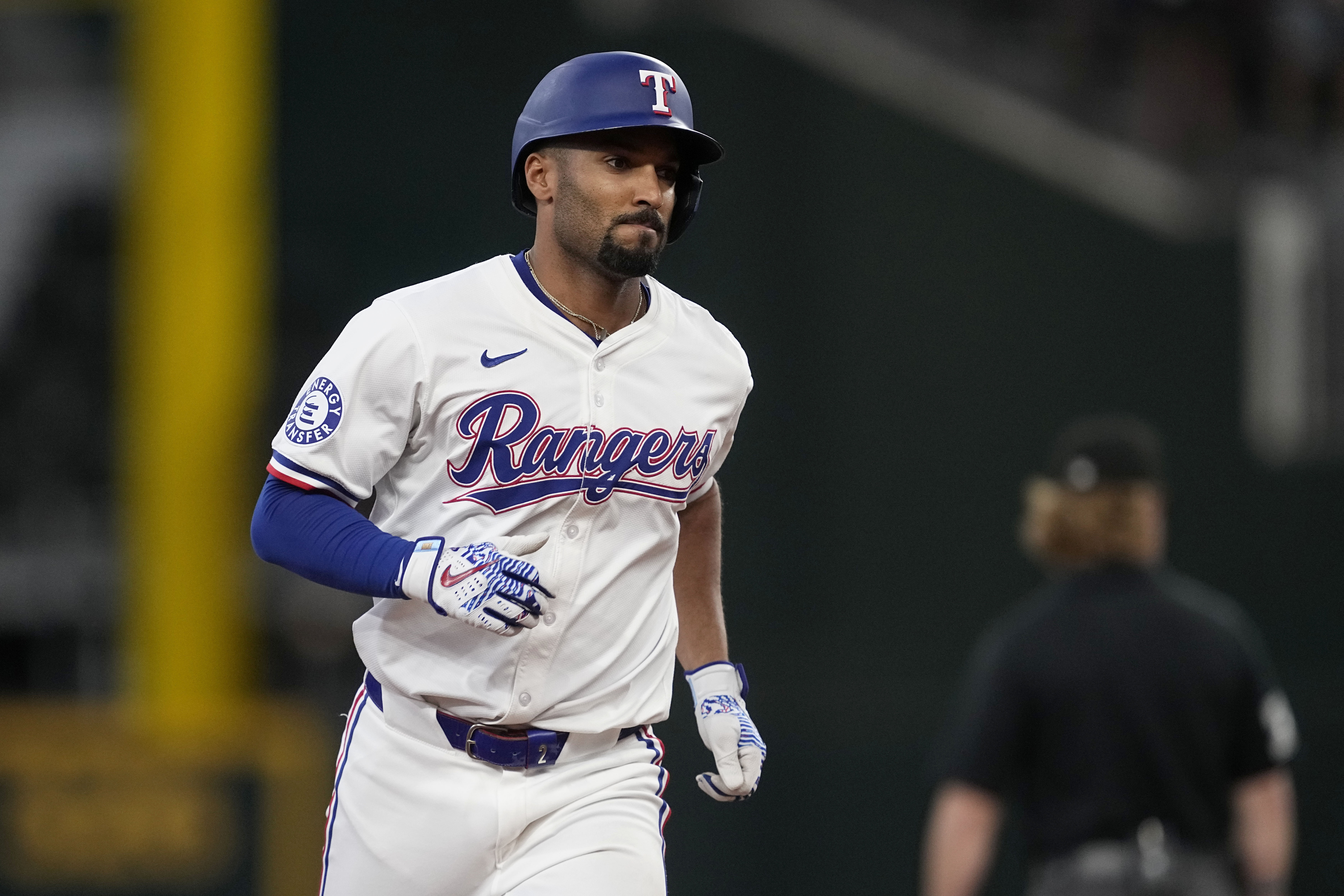 Texas Rangers' Marcus Semien rounds the bases after hitting a two-run home run against the Tampa Bay Rays in the seventh inning of a baseball game in Arlington, Texas, Saturday, July 6, 2024.