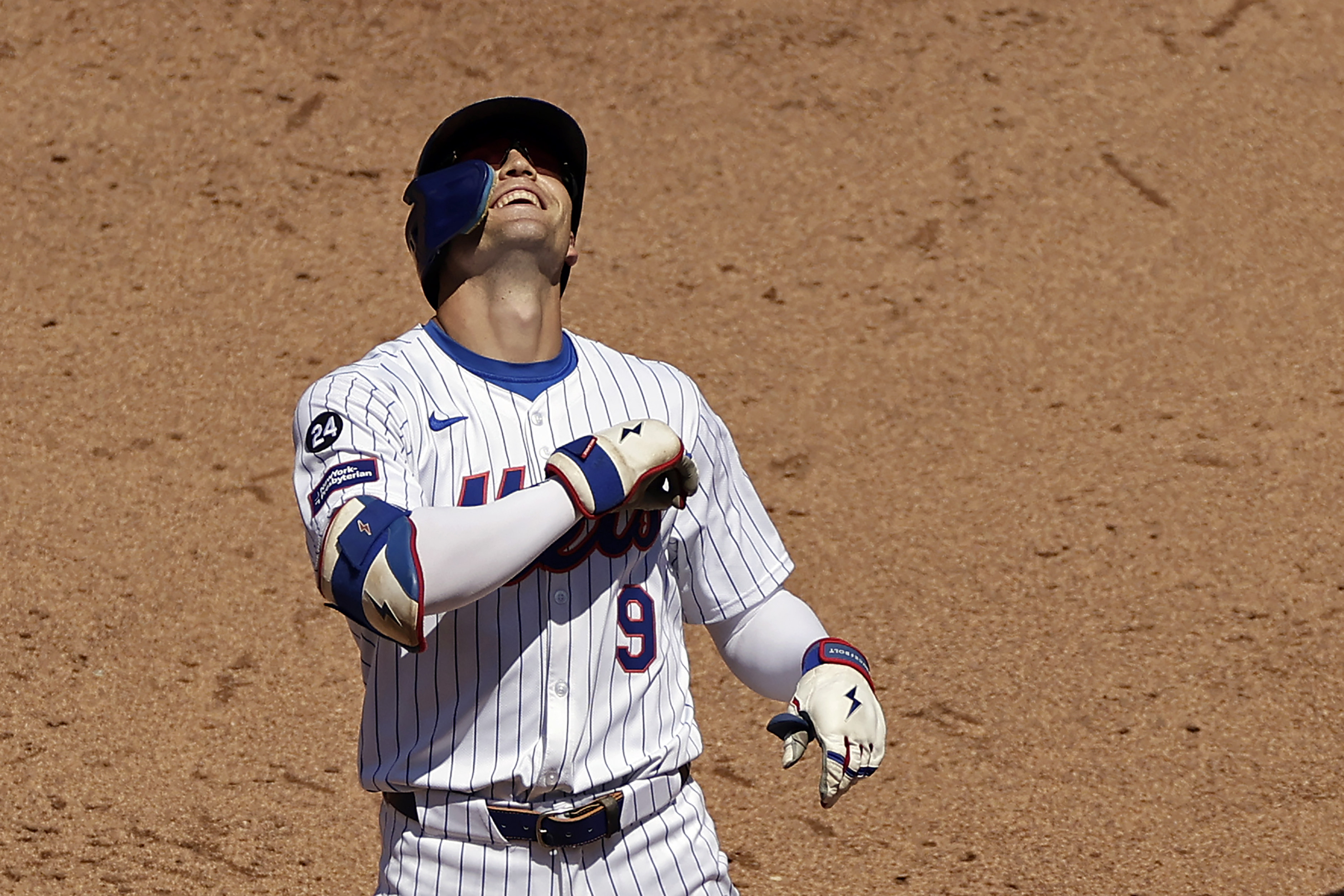 New York Mets' Brandon Nimmo reacts after hitting a three run scoring double during the fifth inning of a baseball game against the Washington Nationals Thursday, July 11, 2024, in New York.