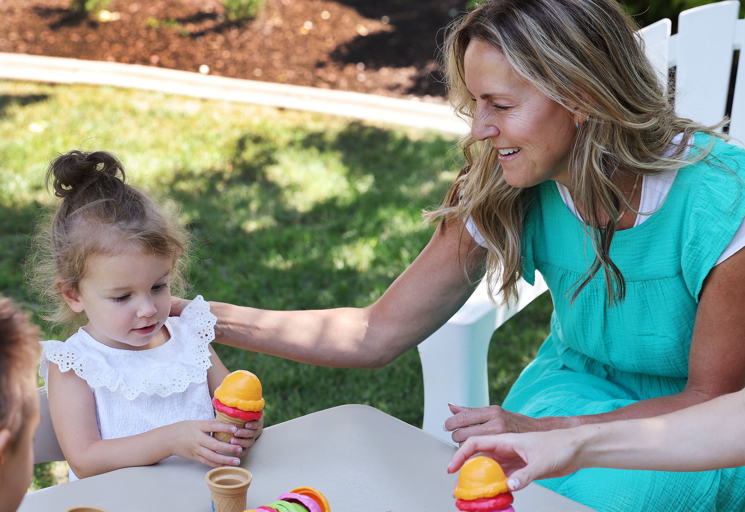 Kris Piggott plays with her granddaughter, Arden, 3, in Provo on Thursday.