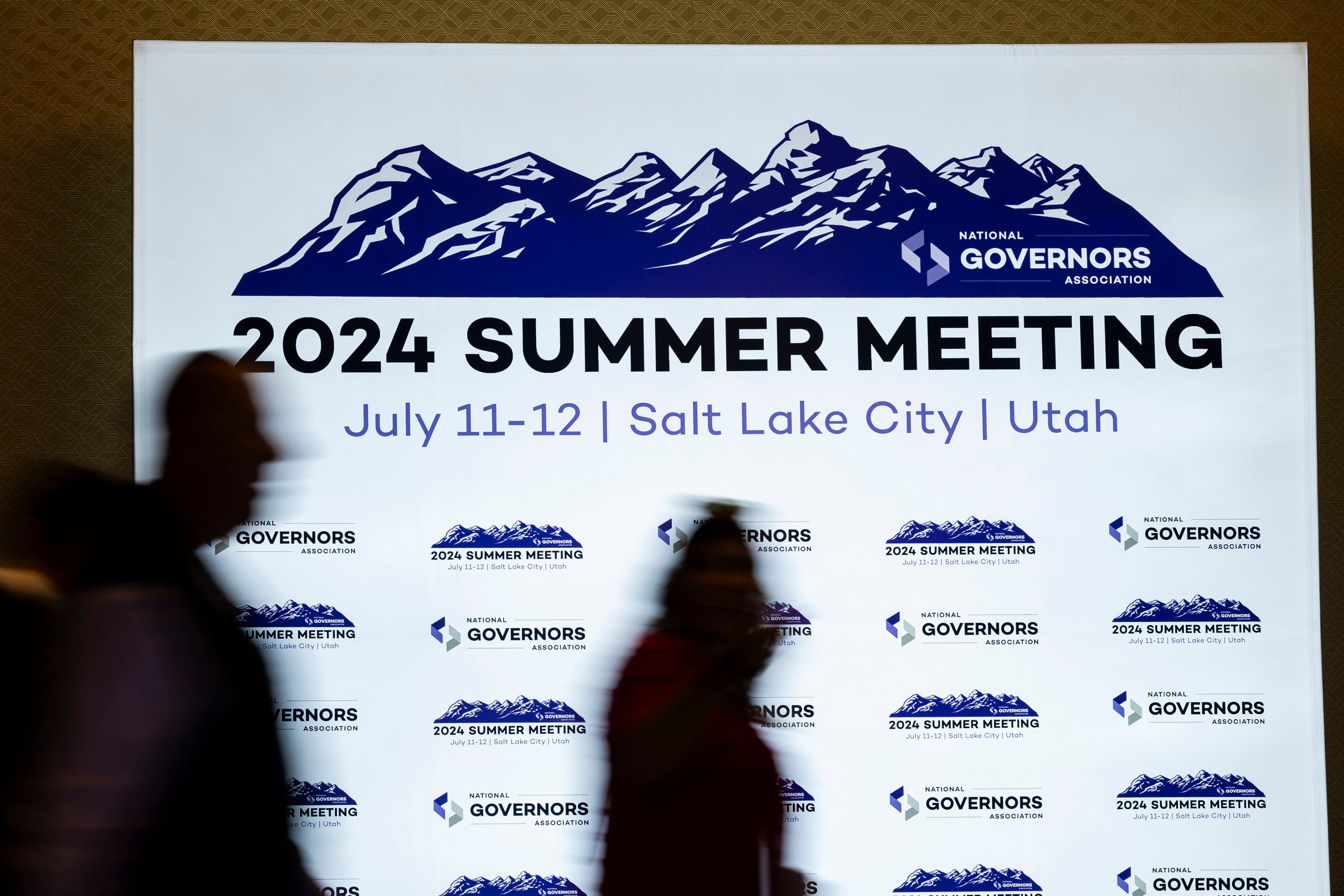 Attendees walk around before opening remarks of an event concerning the "Disagree Better" initiative as part of the National Governors Association’s 2024 Summer Meeting held at the Grand America Hotel in Salt Lake City on Thursday.