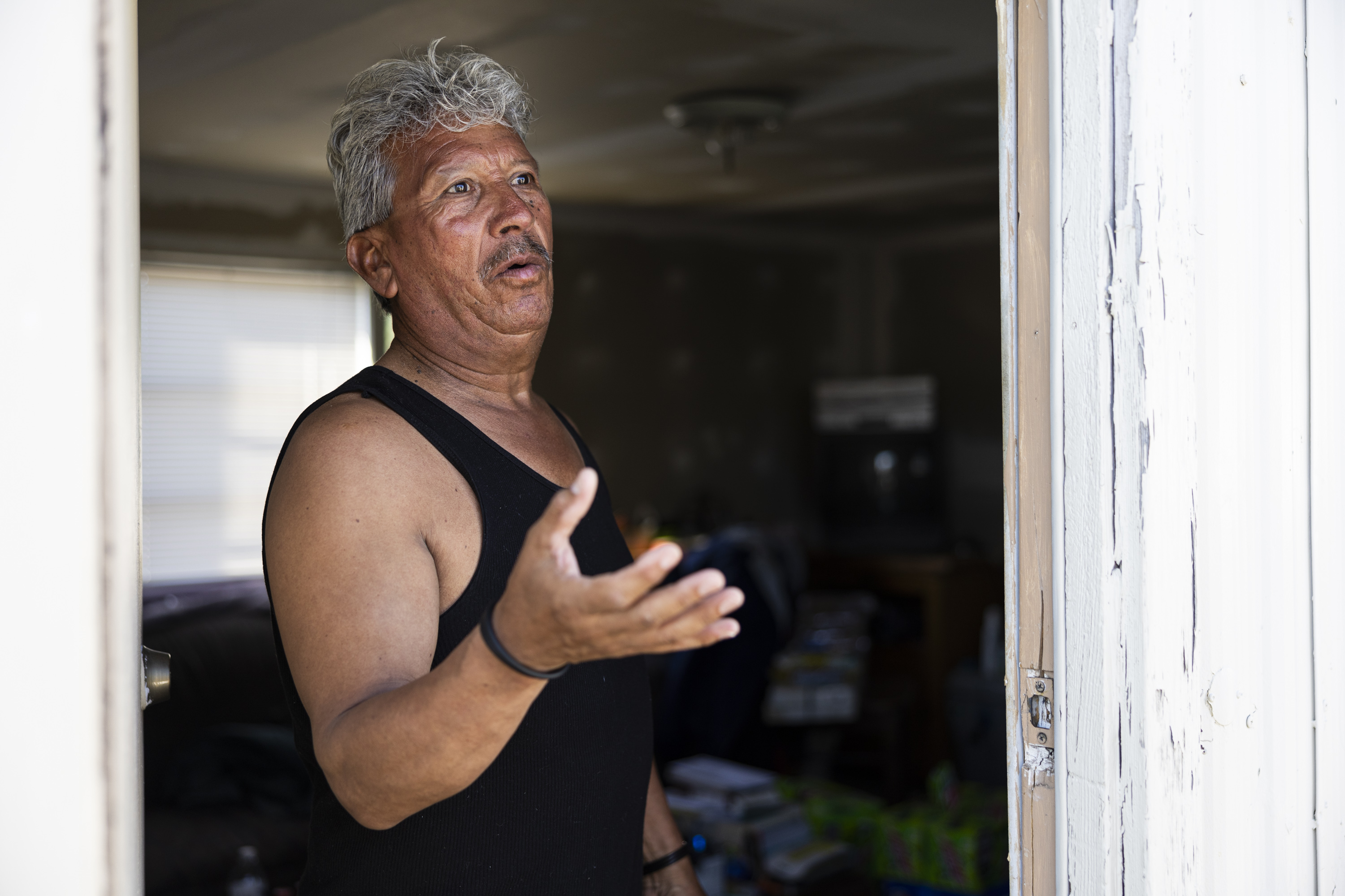 Jorge Gonzalez talks as he’s interviewed at his home at the Cedarwood Mobile Home Park in Layton on July 2.