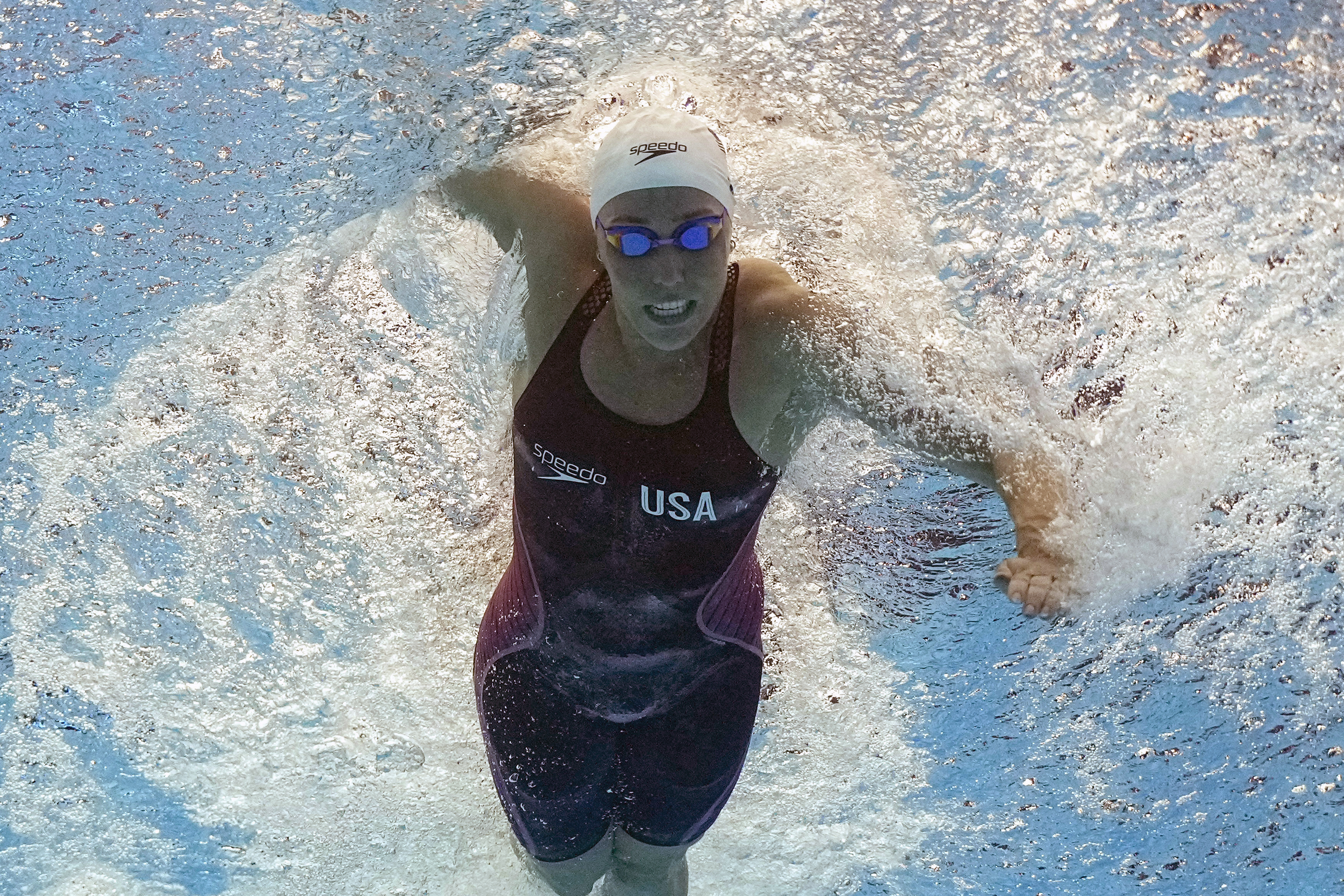 FILE - Abbey Weitzeil, of the United States, competes in a women's 50-meter freestyle heat at the World Swimming Championships in Fukuoka, Japan, Saturday, July 29, 2023. Weitzeil will head to her third Summer Games with only one chance to swim, and not on her own. She'll be part of the 4x100-meter freestyle relay, possibly relegated to a spot in the morning preliminaries, far removed from the spotlight of the evening finals she's so used to.