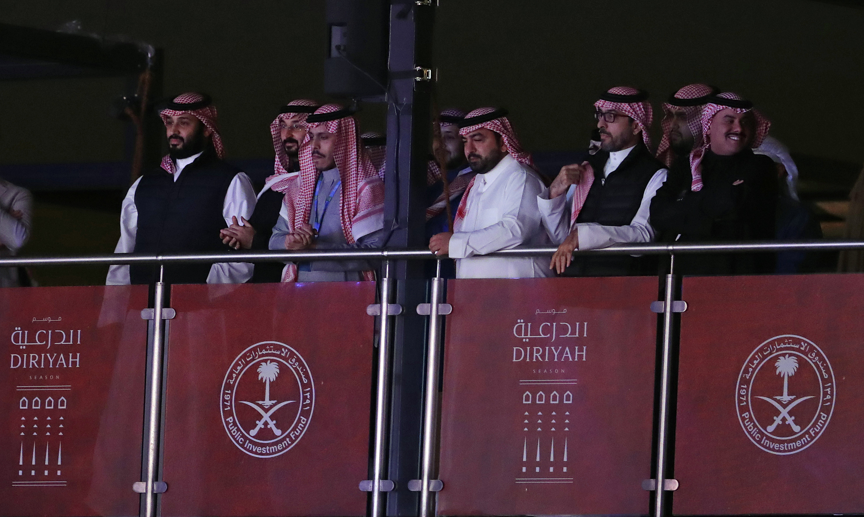 FILE - Saudi Crown Prince Mohammed bin Salman, left, watches as defending champion Andy Ruiz Jr. fights Britain's Anthony Joshua in a World Heavyweight Championship boxing contest at the Diriyah Arena, Riyadh, Saudi Arabia on Dec. 8, 2019. Saudi Arabia and the IOC are teaming up for their first commercial deal together with the oil-rich kingdom set to host the first Esports Olympics next year. The gaming partnership will be for 12 years “with Olympic Esports Games held regularly,” the International Olympic Committee said in a statement Friday July 12, 2024. 