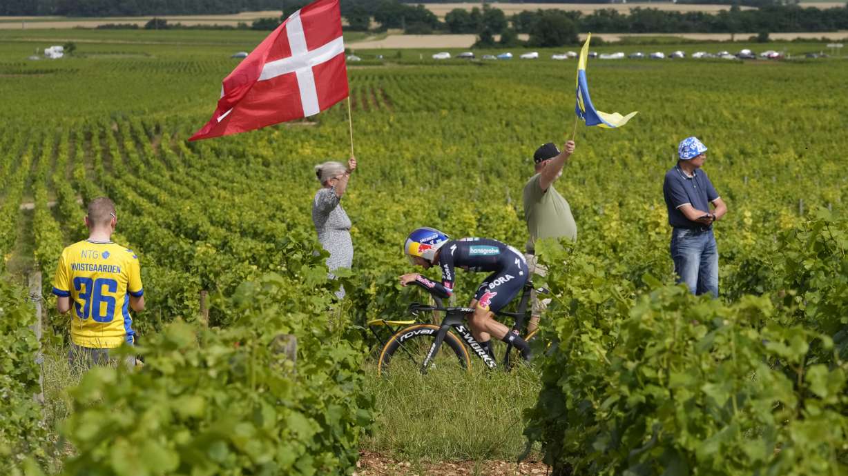 Slovenia's Primoz Roglic rides through the vineyards during the seventh stage of the Tour de France cycling race, an individual time-trial over 25.3 kilometers (15.7 miles) with start Nuits-Saint-Georges and finish in Gevrey-Chambertin, France, Friday, July 5, 2024.