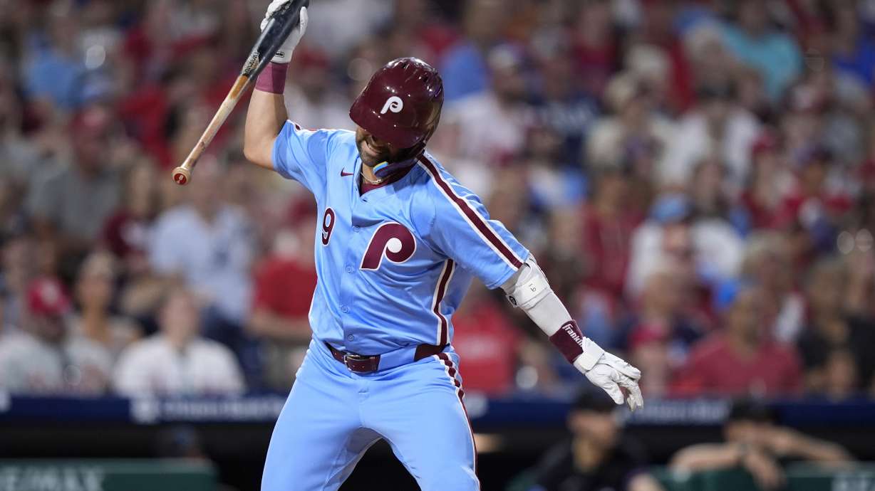 Philadelphia Phillies' Whit Merrifield reacts after flying out against Miami Marlins pitcher A.J. Puk during the eighth inning of a baseball game, Thursday, June 27, 2024, in Philadelphia.