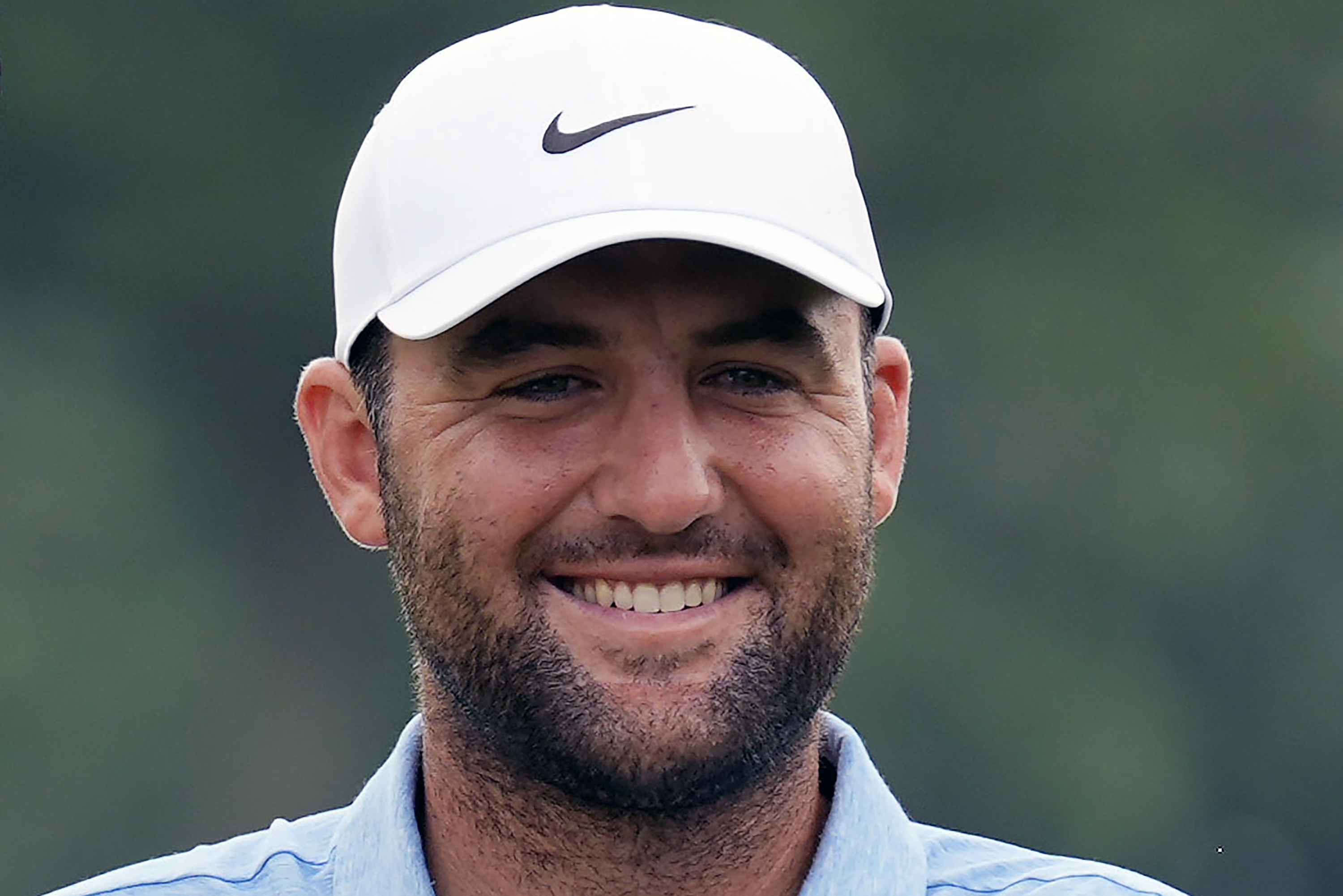 FILE - Scottie Scheffler smiles after winning the Travelers Championship golf tournament at TPC River Highlands, Sunday, June 23, 2024, in Cromwell, Conn. Scheffler is expected to play in the 151st British Open, which starts Thursday, July 18, at Royal Liverpool.