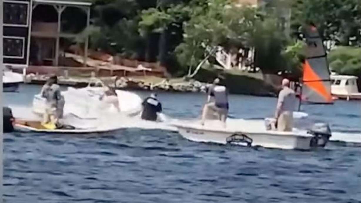 Brady Procon, 17, jumps aboard a moving boat last week on Lake Winnipesaukee, in Gilford, New Hampshire.