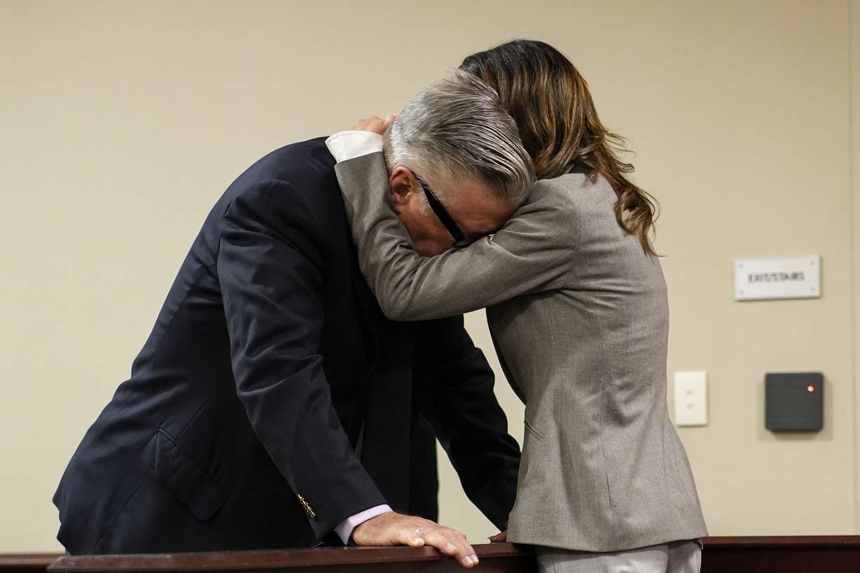 Hilaria Baldwin, right, speaks to her husband, actor Alec Baldwin, during his trial for involuntary manslaughter for the 2021 fatal shooting of cinematographer Halyna Hutchins during filming of the Western movie "Rust," Friday, at Santa Fe County District Court in Santa Fe, N.M.