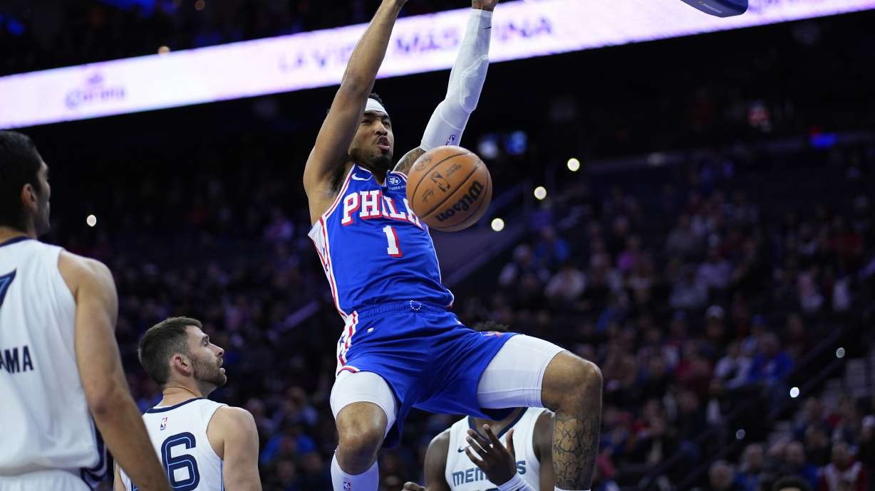 FILE - Philadelphia 76ers' KJ Martin (1) hangs from the rim after dunking during the first half of an NBA basketball game against the Memphis Grizzlies, March 6, 2024, in Philadelphia. The 76ers are keeping at least one player acquired in the James Harden deal, coming to an agreement on a two-year, $16-million contract with forward Martin a person with knowledge of the deal told The Associated Press, Friday, July 12, 2024.