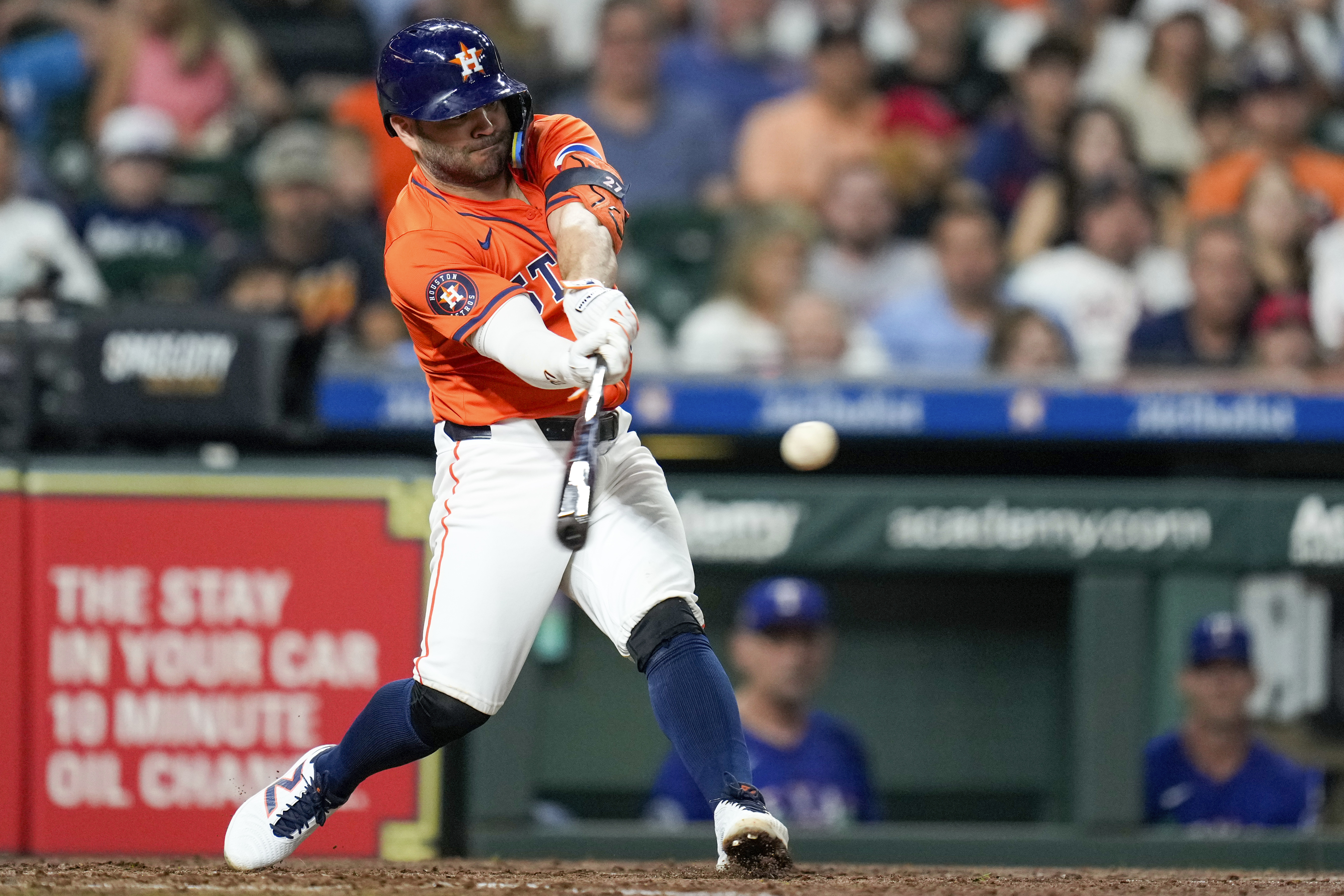 Houston Astros' Jose Altuve hits a three-run home run against the Texas Rangers during the sixth inning of a baseball game Friday, July 12, 2024, in Houston. 