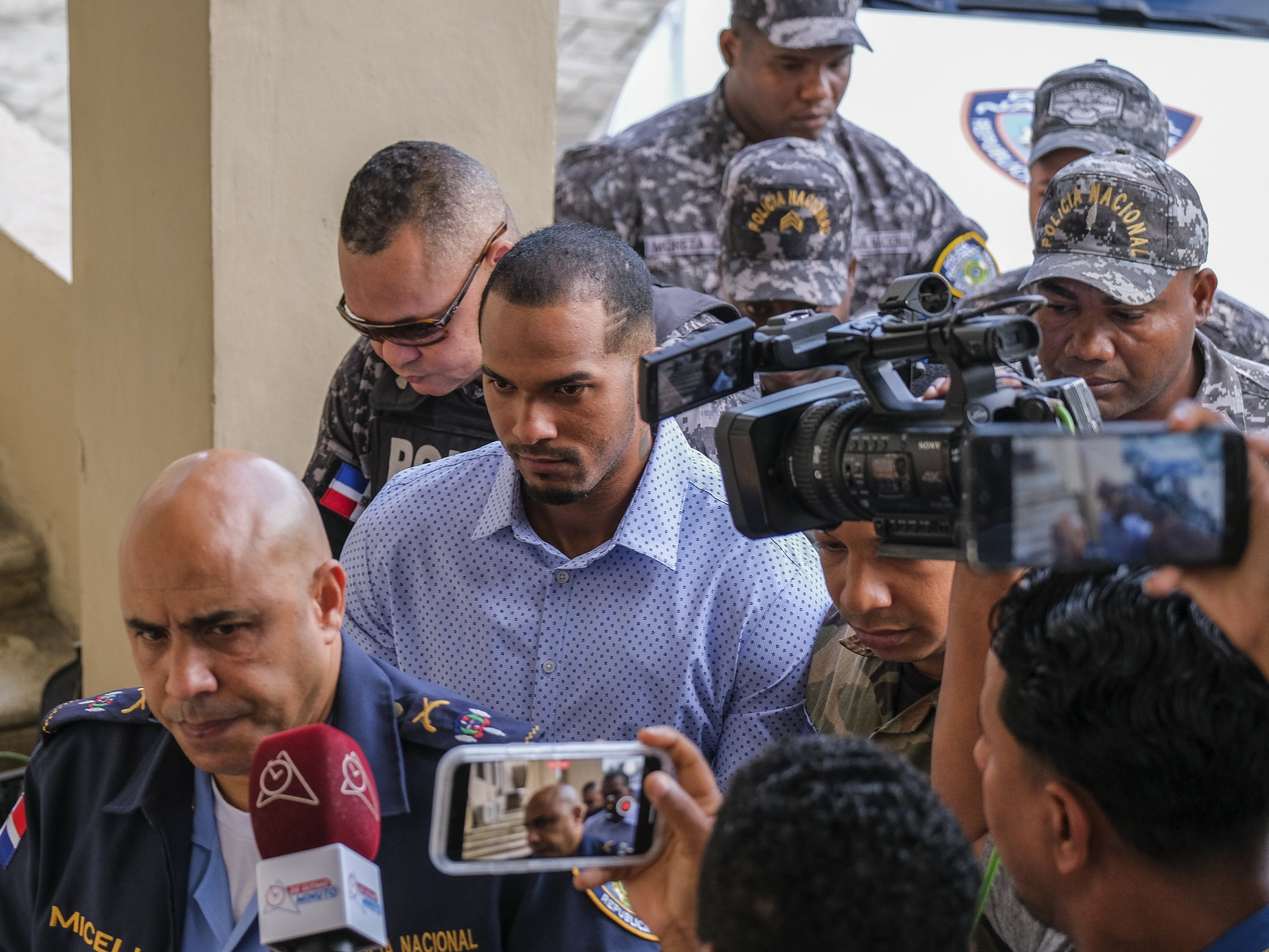 FILE - Tampa Bay Rays shortstop Wander Franco, center, is escorted by police to court in Puerto Plata, Dominican Republic, Jan. 5, 2024. Dominican prosecutors formally accused Franco on Tuesday, July 9, 2024, of sexual abuse against a 14-year-old girl.