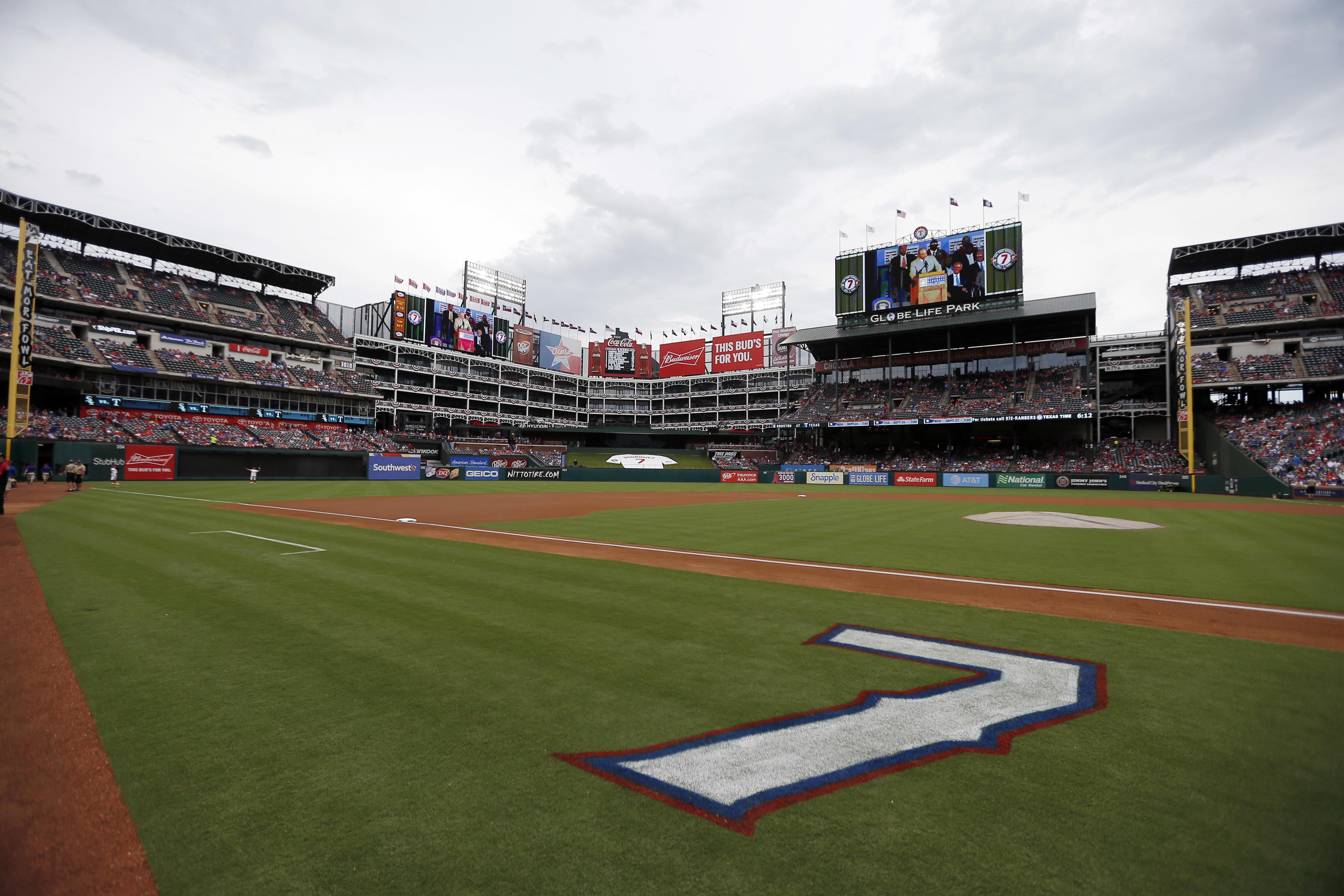 FILE - The jersey number of former Texas Rangers player Ivan Rodriguez is painted on the field for a ceremony where the number was retired by the ball club before a baseball game against the Houston Astros in Arlington, Texas, Aug. 12, 2017. Major League Baseball is playing its All-Star Game in Arlington for the first time since 1995, when the Rangers played outside in the stifling heat. This year's game will be played Tuesday, July 16, 2024, in their stadium with a retractable roof that opened in 2020. 