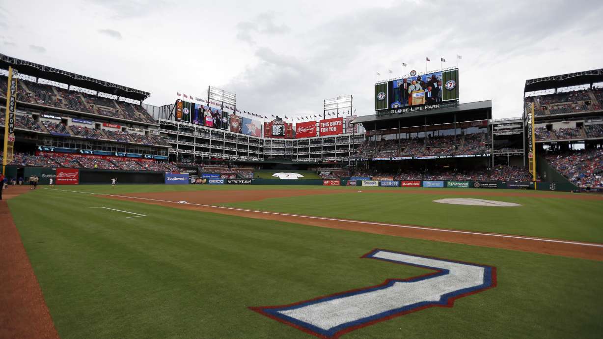 FILE - The jersey number of former Texas Rangers player Ivan Rodriguez is painted on the field for a ceremony where the number was retired by the ball club before a baseball game against the Houston Astros in Arlington, Texas, Aug. 12, 2017. Major League Baseball is playing its All-Star Game in Arlington for the first time since 1995, when the Rangers played outside in the stifling heat. This year's game will be played Tuesday, July 16, 2024, in their stadium with a retractable roof that opened in 2020.