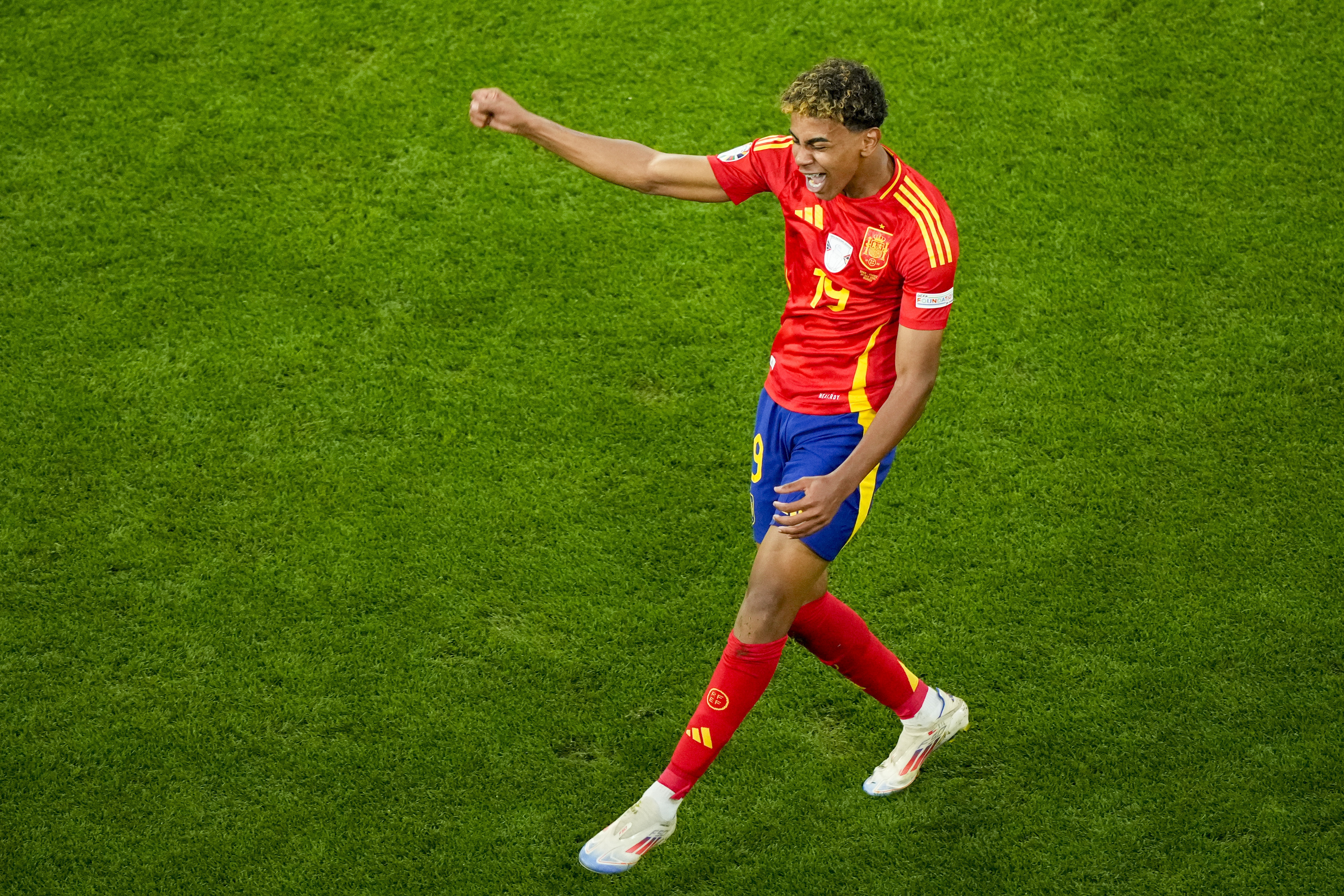 Spain's Lamine Yamal celebrates scoring his side's first goal during a semifinal match between Spain and France at the Euro 2024 soccer tournament in Munich, Germany, Tuesday, July 9, 2024.