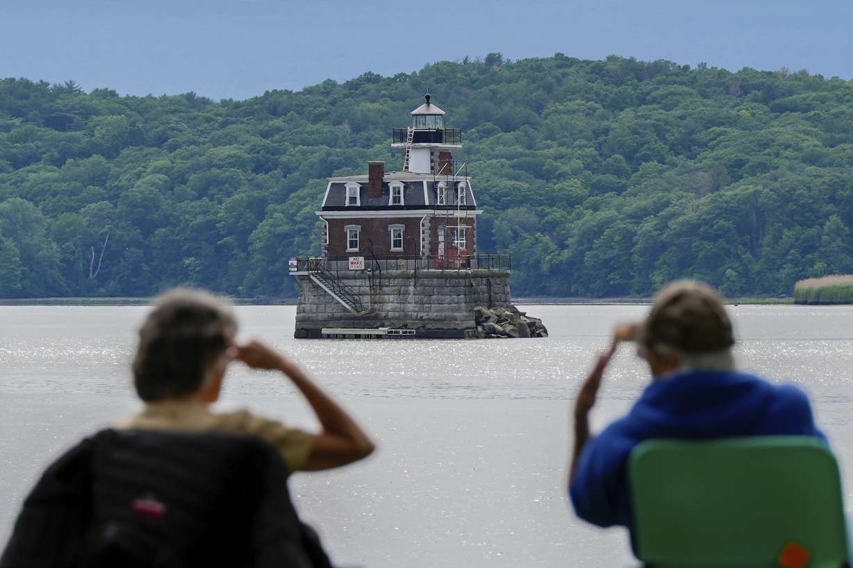 People look at the Hudson-Athens Lighthouse, Wednesday, June 12, 2024, in Hudson, N.Y.