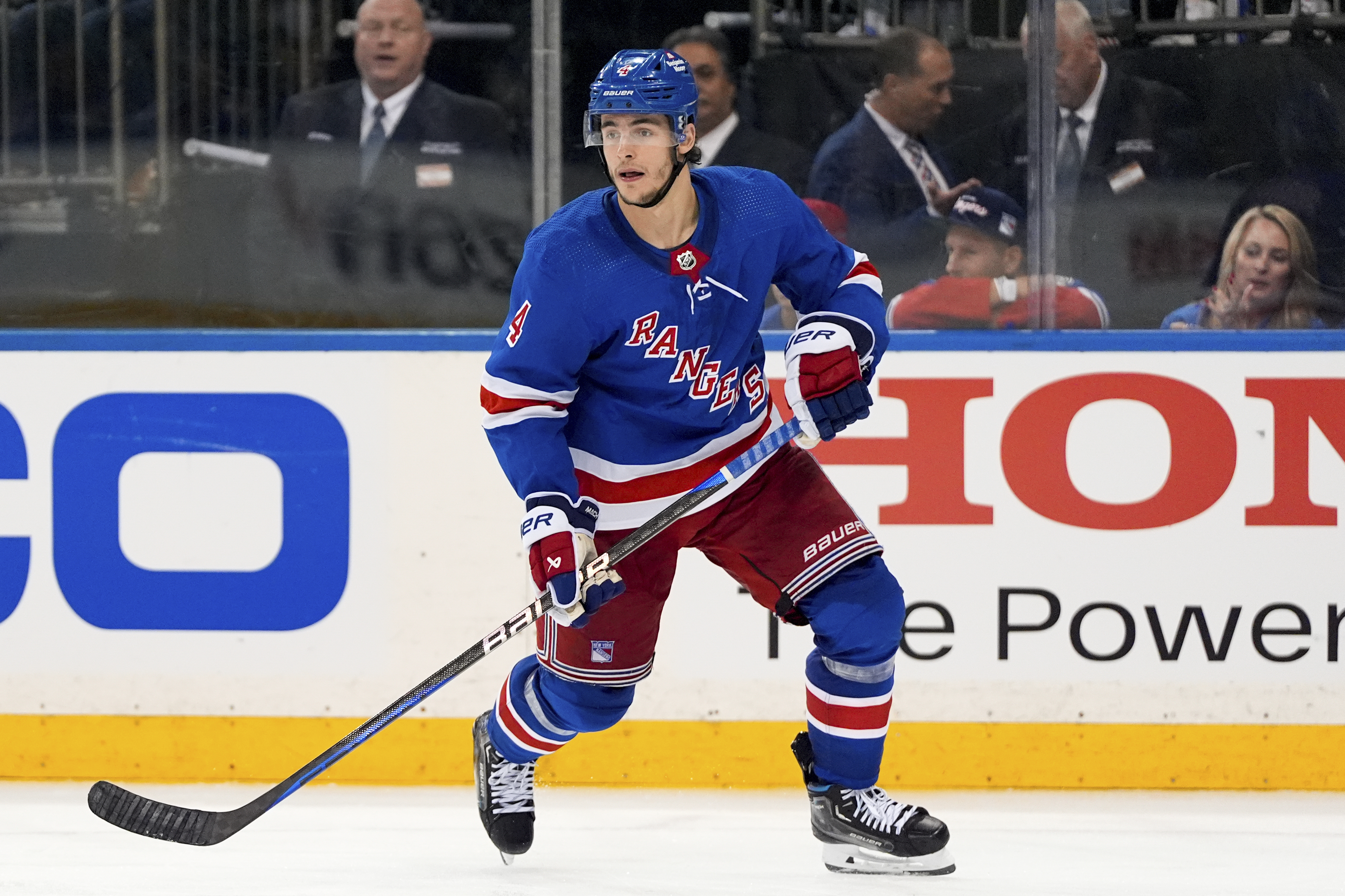 FILE - New York Rangers defenseman Braden Schneider (4) skates during the third period of Game 1 of the NHL hockey Eastern Conference Stanley Cup playoff finals against the Florida Panthers, Wednesday, May 22, 2024, in New York. The New York Rangers and up-and-coming defenseman Braden Schneider have agreed on a two-year $4.4 million contract extension. General manager Chris Drury announced the deal with the 22-year-old Schneider on Saturday, , July 13, 2024, leaving fellow defenseman Ryan Lindgren as the only unsigned starter on defense. Lindgren has filed for arbitration.