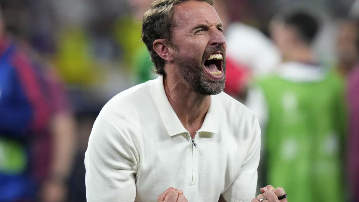 England's manager Gareth Southgate celebrates after winning a semifinal match between the Netherlands and England at the Euro 2024 soccer tournament in Dortmund, Germany, Wednesday, July 10, 2024.