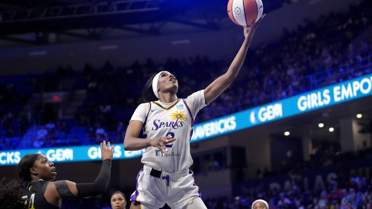 Los Angeles Sparks forward Rickea Jackson (2) leaps to the basket for a shot-attempt after getting past Dallas Wings' Arike Ogunbowale, left, in the second half of a WNBA basketball game in Arlington, Texas, Saturday, July 13, 2024.