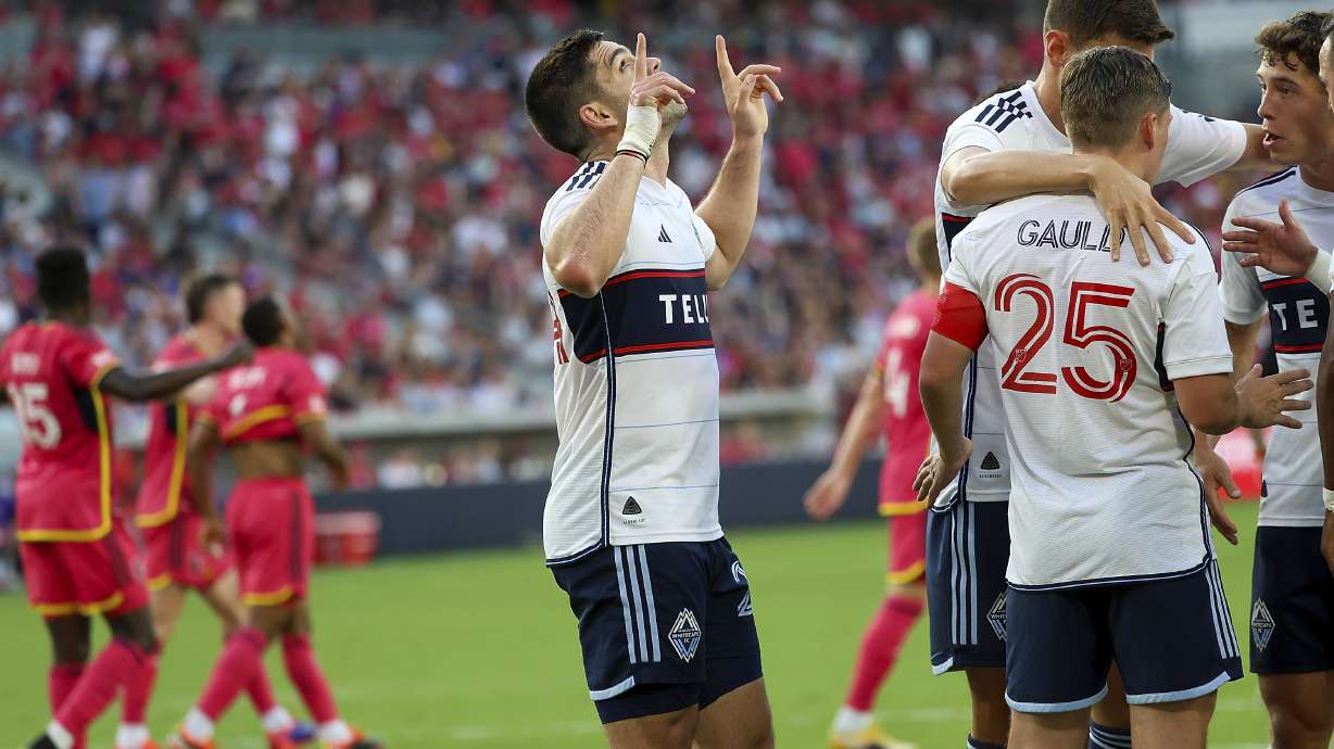 Vancouver Whitecaps' Brian White, center, gestures skyward after scoring during the first half of an MLS soccer match against St. Louis City, Saturday, July 13, 2024, in St. Louis.