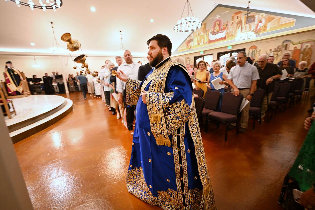 Archdeacon Dionysios, participates in the ceremony as St. Anna’s Greek Orthodox Church celebrates its opening of a new church in Sandy on Saturday.