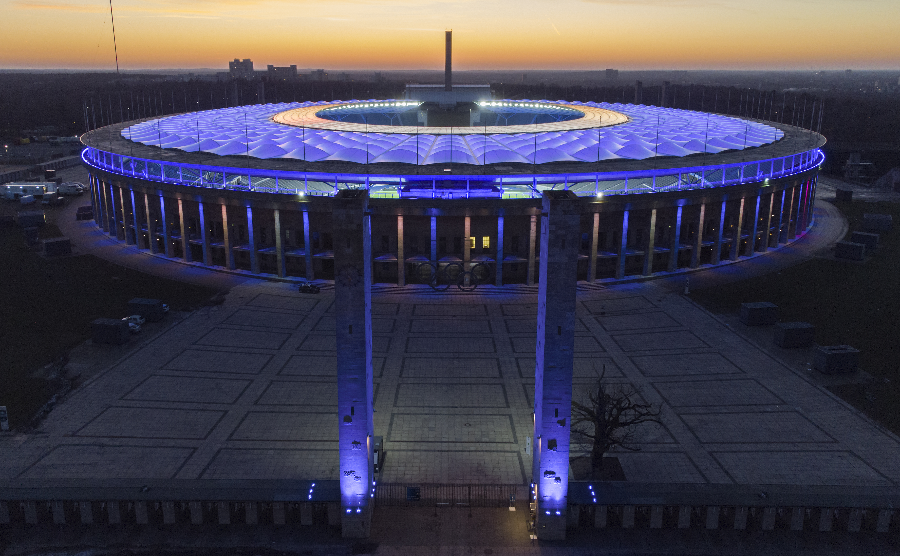 FILE - In this Feb. 21, 2021 file photo, the Olympic Stadium is illuminated as the sun sets after the German Bundesliga soccer match between Hertha BSC Berlin and RB Leipzig in Berlin, Germany. Scars of World War II and relics from its Nazi past are preserved at Berlin's Olympiastadion. When Spain plays England in the European Championship final, they will be playing in a stadium that doesn't hide it was built by the Nazis for the 1936 Olympic Games. 