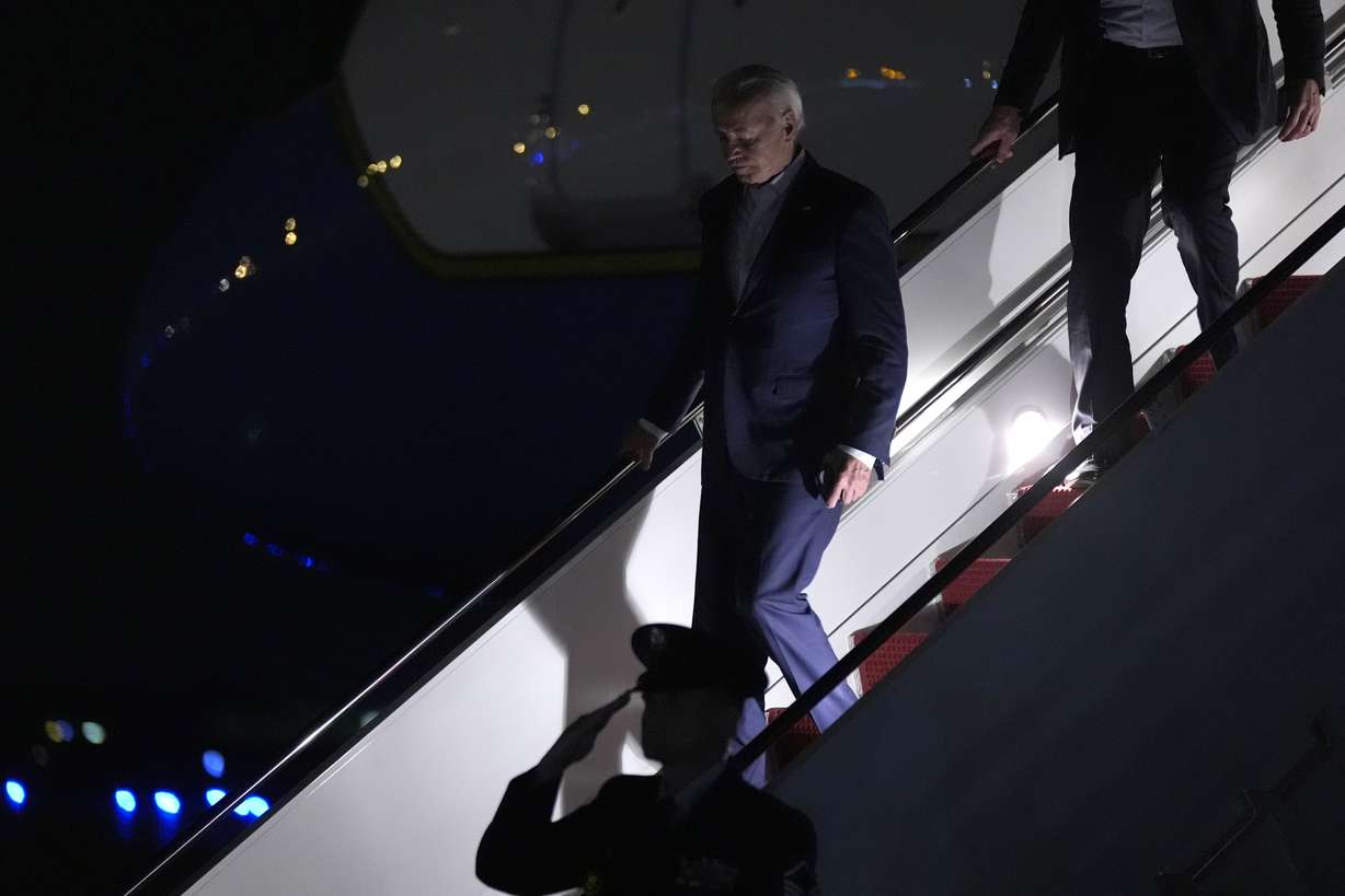 President Joe Biden arrives on Air Force One at Andrews Air Force Base, Md., Saturday. President Biden is going back to Washington from Delaware earlier than planned following the attack at the Trump rally in Pennsylvania.