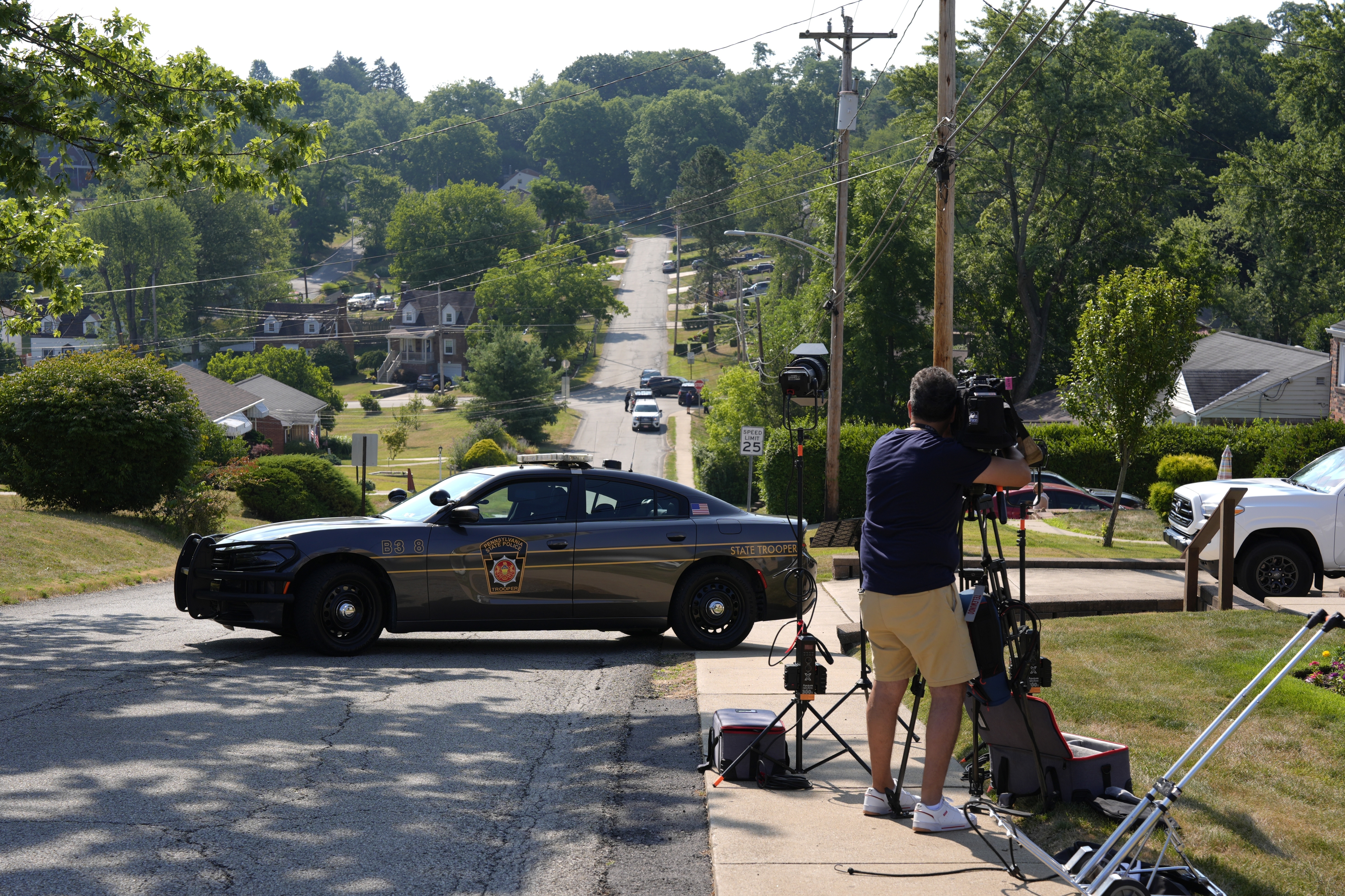 Law enforcement block a street in Bethel Park, Pa., that they say is near the residence of Thomas Matthew Crooks, the suspected shooter of former President Donald Trump, Sunday.