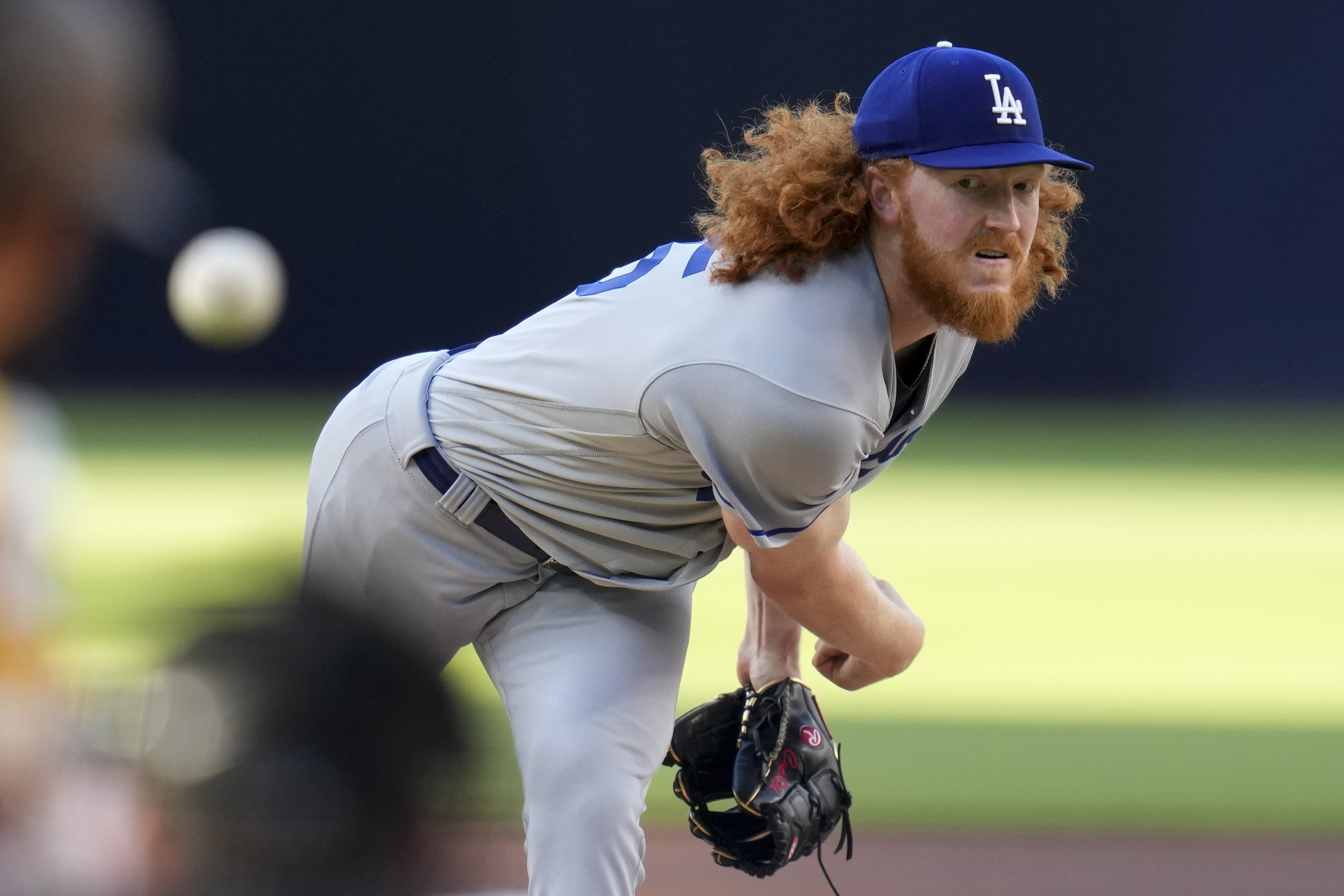 FILE - Los Angeles Dodgers starting pitcher Dustin May works against a San Diego Padres batter during the first inning of a baseball game, May 6, 2023, in San Diego. May had esophagus surgery and won't return this season, another setback for him and the team’s banged-up pitching staff. May needed the procedure to repair a tear after he experienced discomfort following a dinner earlier in the week, the Dodgers confirmed Sunday, July 14, 2024. 