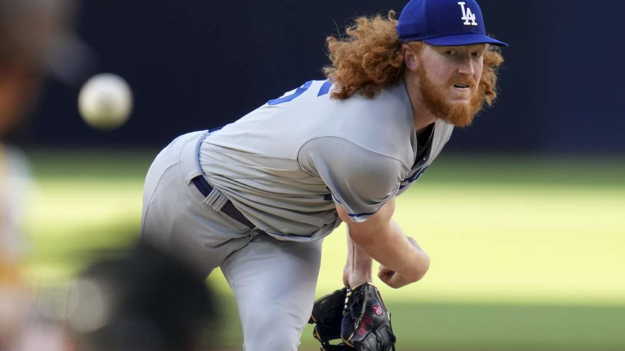 FILE - Los Angeles Dodgers starting pitcher Dustin May works against a San Diego Padres batter during the first inning of a baseball game, May 6, 2023, in San Diego. May had esophagus surgery and won't return this season, another setback for him and the team’s banged-up pitching staff. May needed the procedure to repair a tear after he experienced discomfort following a dinner earlier in the week, the Dodgers confirmed Sunday, July 14, 2024.
