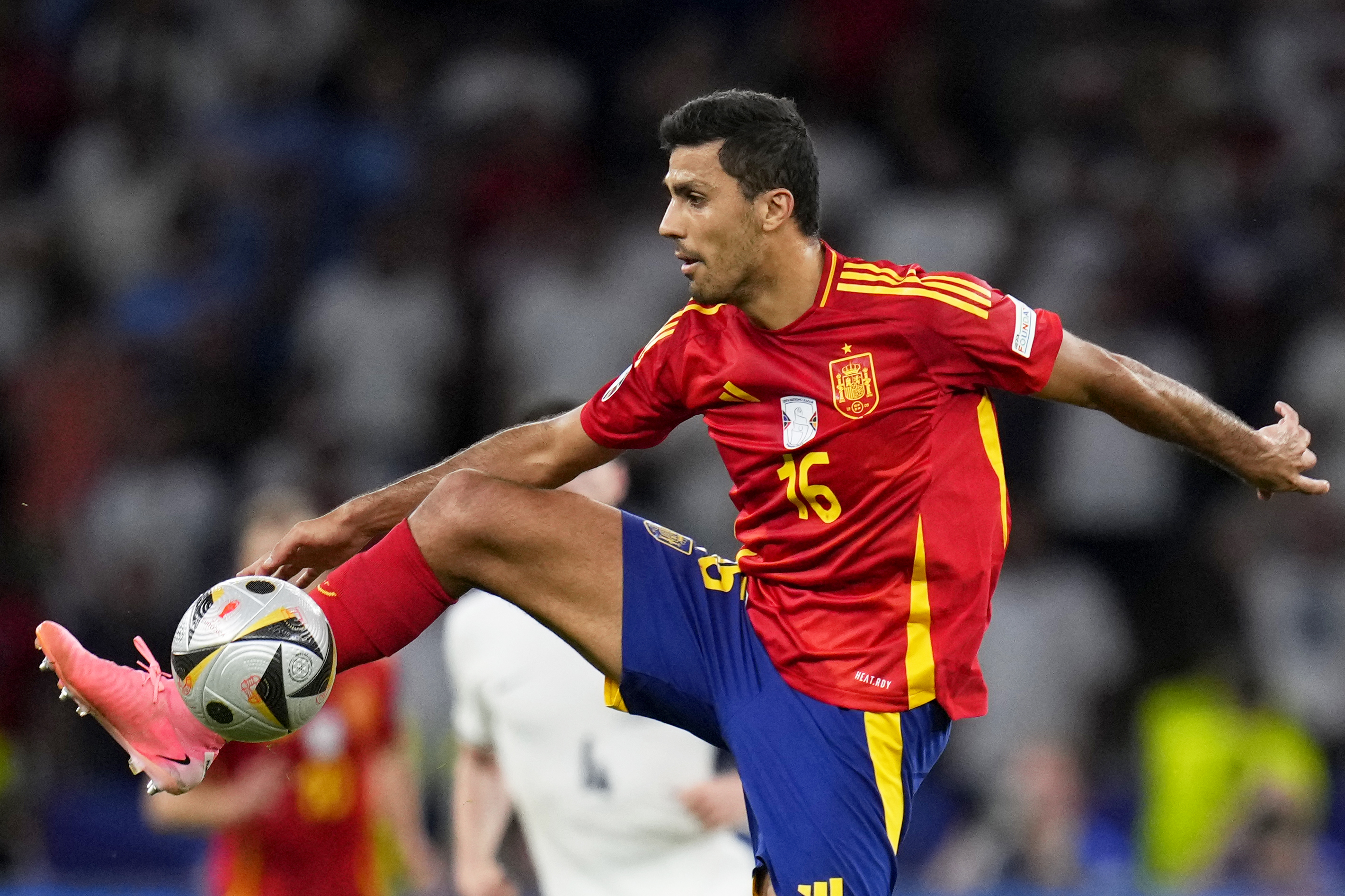 Spain's Rodri controls the ball during the final match between Spain and England at the Euro 2024 soccer tournament in Berlin, Germany, Sunday, July 14, 2024. 