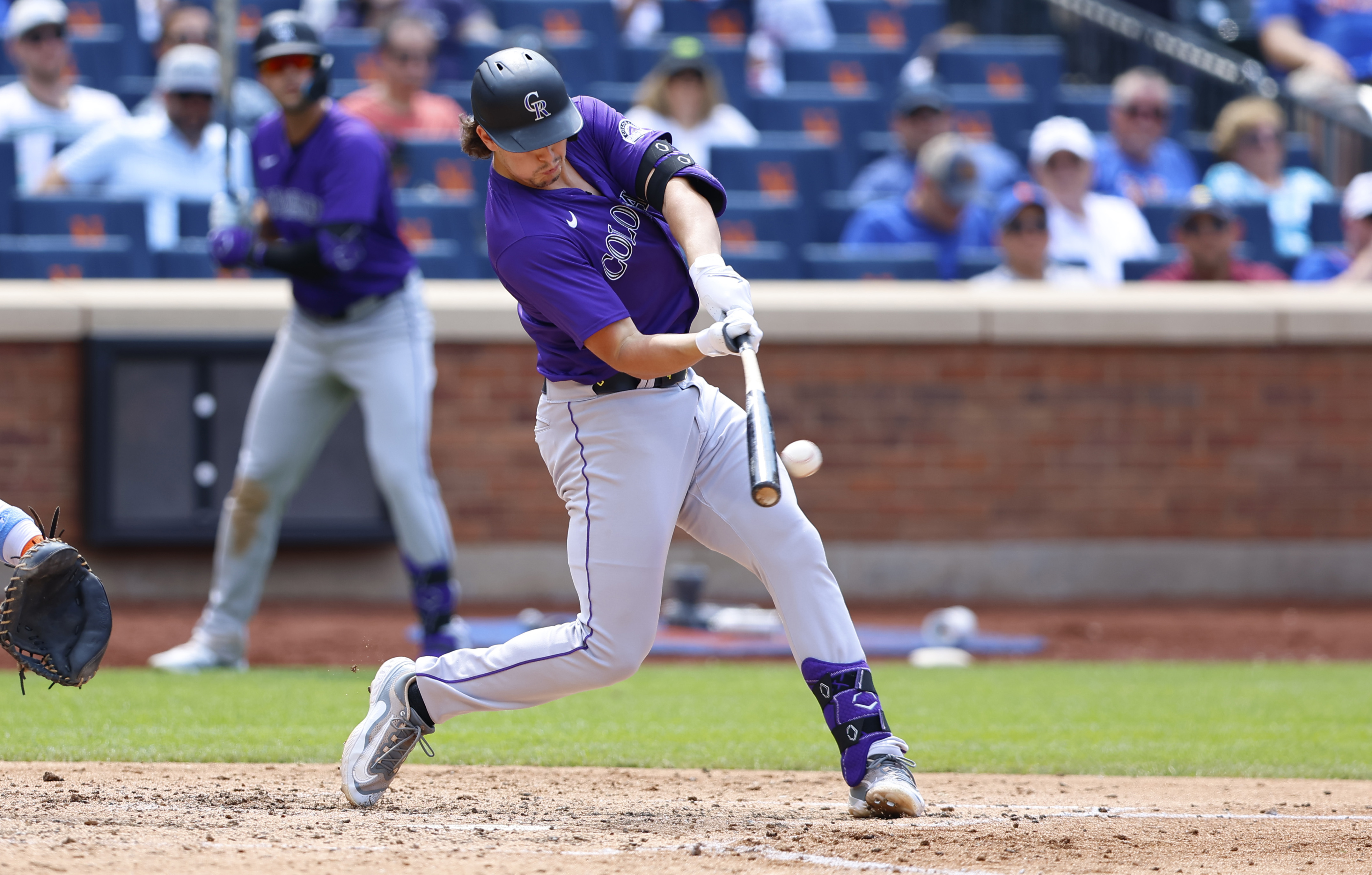 Colorado Rockies' Michael Toglia (4) hits a home run against the New York Mets during the sixth inning of a baseball game, Sunday, July 14, 2024, in New York. 