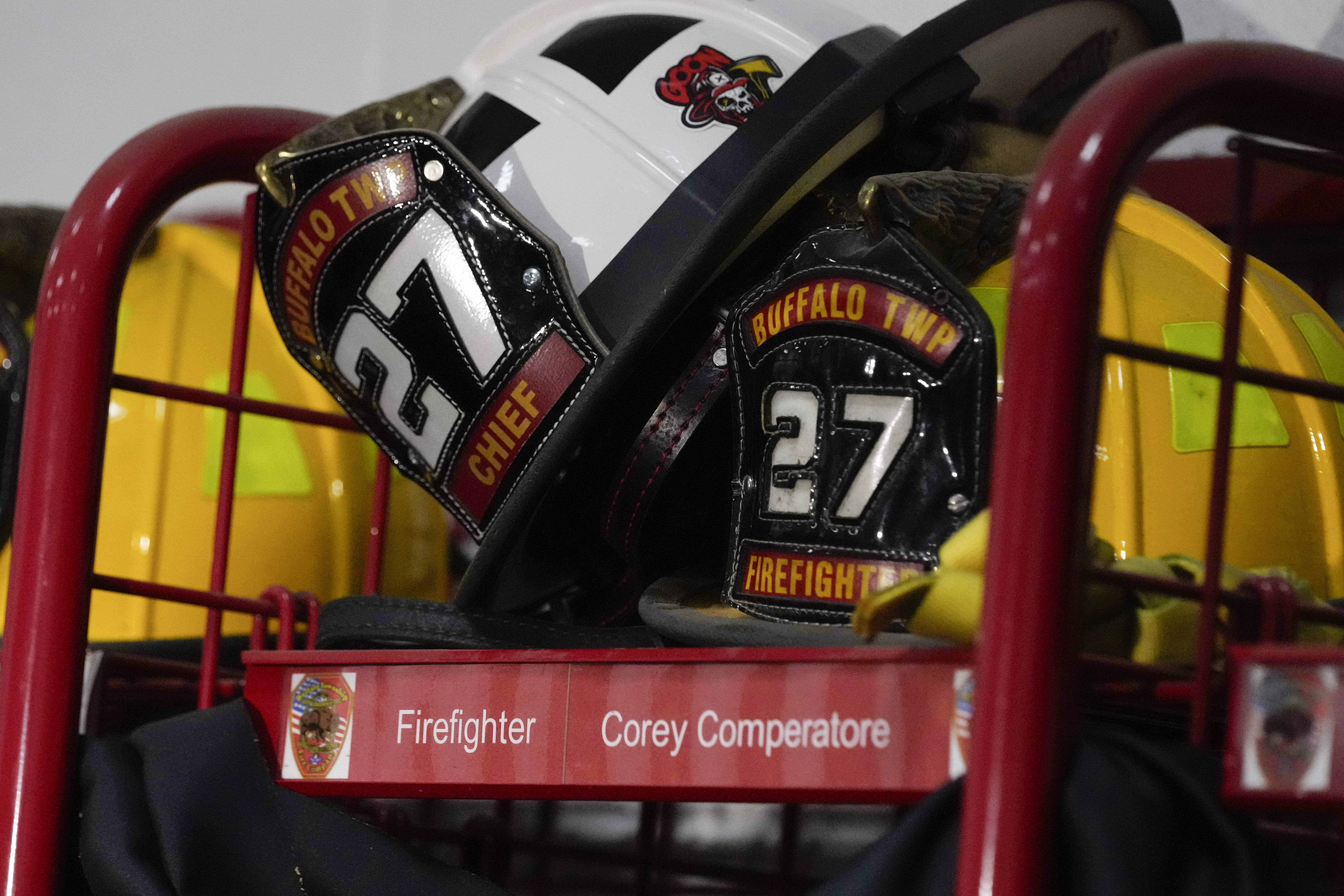 Helmets rest on the locker of firefighter Corey Comperatore at the Buffalo Township Fire Company 27 in Buffalo Township, Pa., Sunday. Comperatore was killed during a shooting at a campaign rally for Republican presidential candidate former President Donald Trump in Butler, Pa., on Saturday.