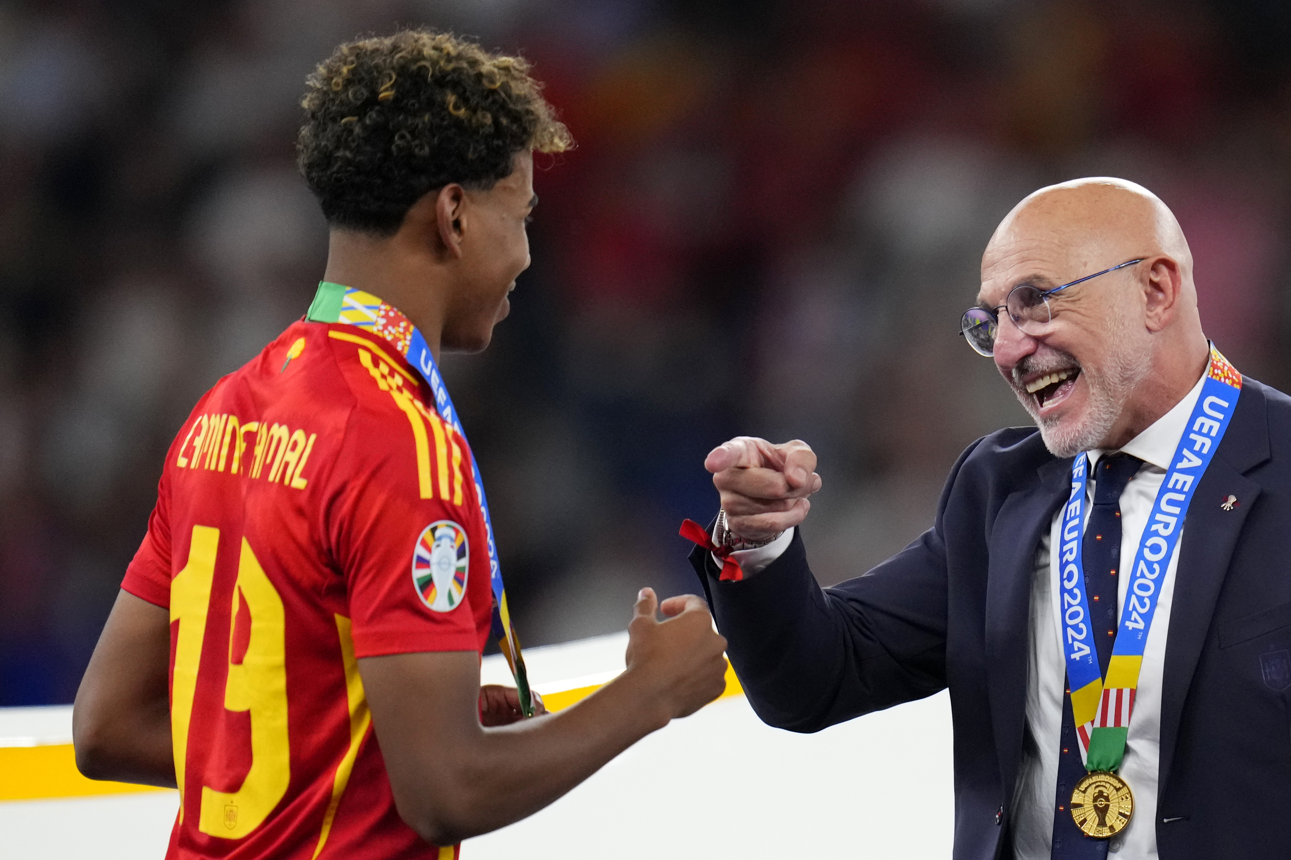Spain's head coach Luis de la Fuente gestures to Lamine Yamal after they collected their medals for winning the final match between Spain and England at the Euro 2024 soccer tournament in Berlin, Germany, Sunday, July 14, 2024. Spain won 2-1. 