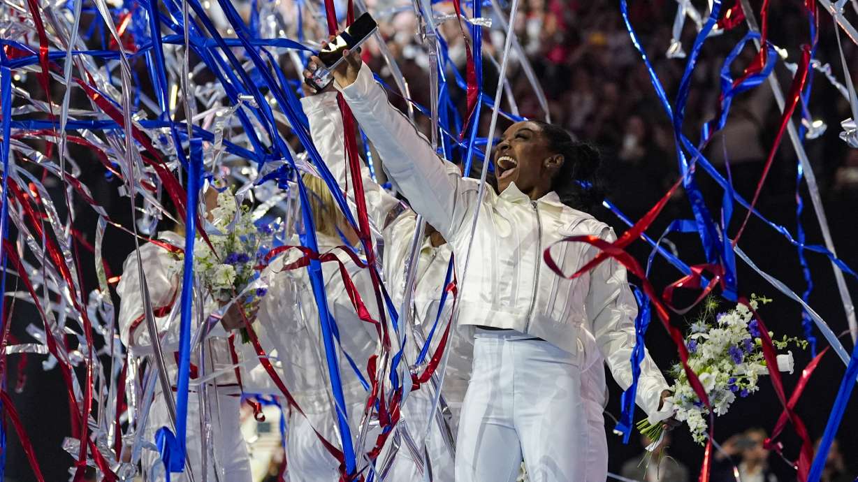 FILE - Simone Biles and the U.S. women celebrate as the 2024 team is named at the United States Gymnastics Olympic Trials on Sunday, June 30, 2024, in Minneapolis.